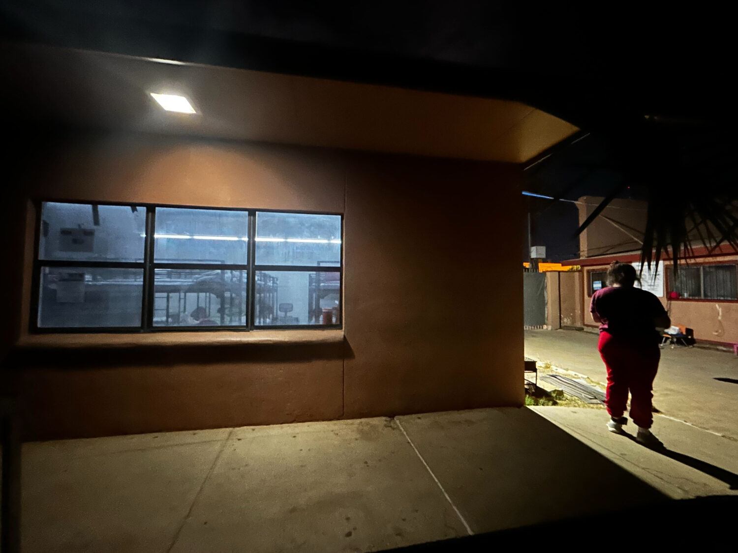 Immigrant families settle in for the night at the Holding Institute in Laredo, Texas, on Feb. 12, 2...