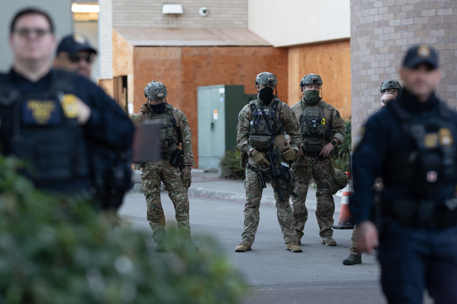 FILE - Law enforcement officers look out from a United States Immigration and Customs Enforcement (...