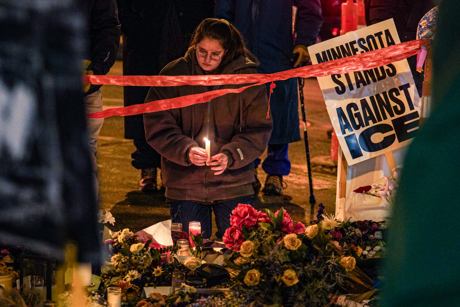 People visit a makeshift memorial for Alex Pretti, who was fatally shot by a U.S. Border Patrol off...