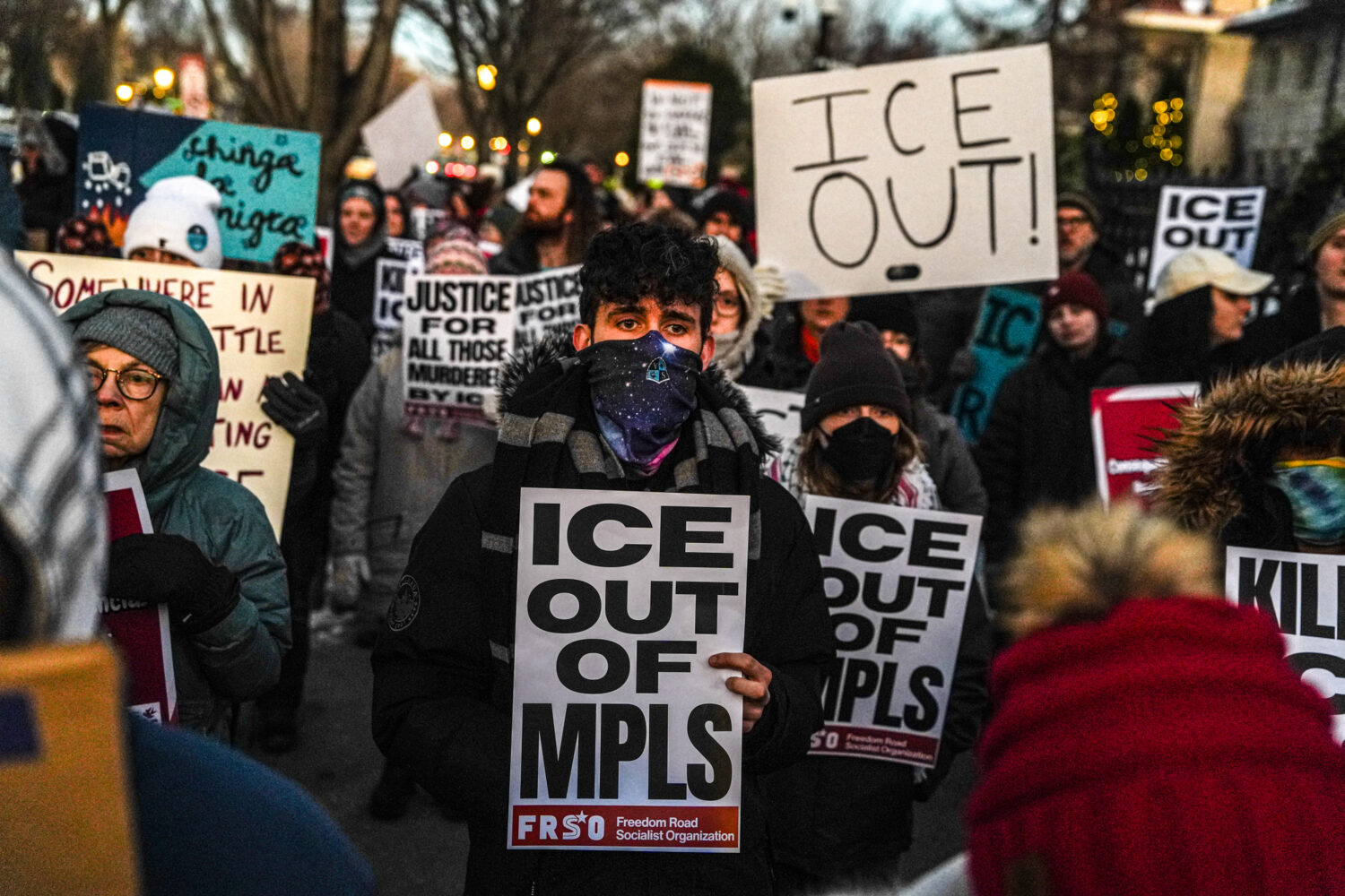 People participate in an anti-ICE protest outside of the Governors Residence, Friday, Feb. 6, 2026,...