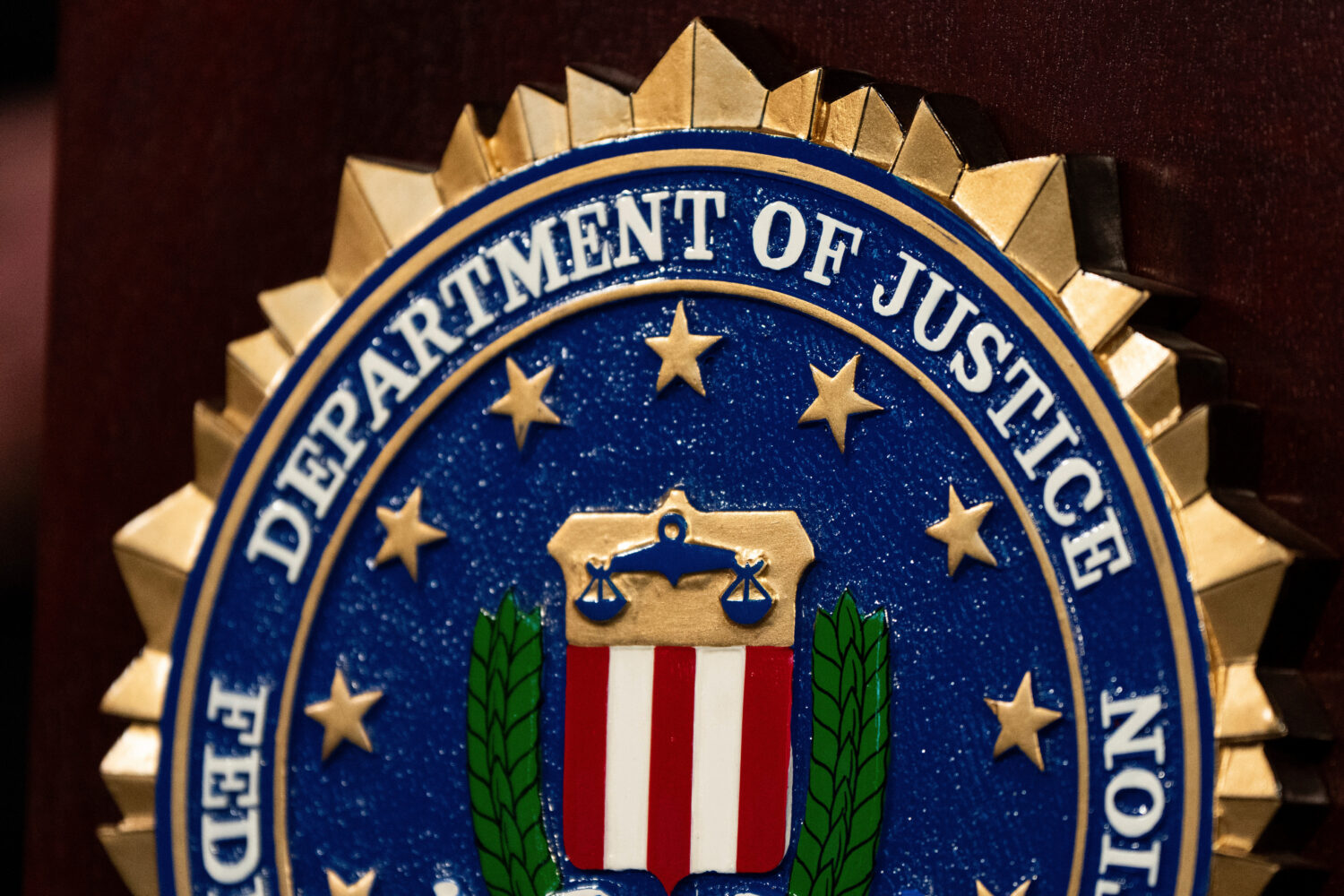 FILE - An FBI seal is displayed on a podium before a news conference at the field office in Portlan...