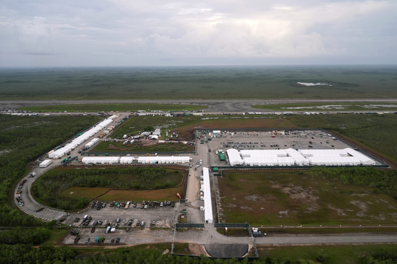 FILE - Work progresses on a new migrant detention facility dubbed "Alligator Alcatraz," at Dade-Col...