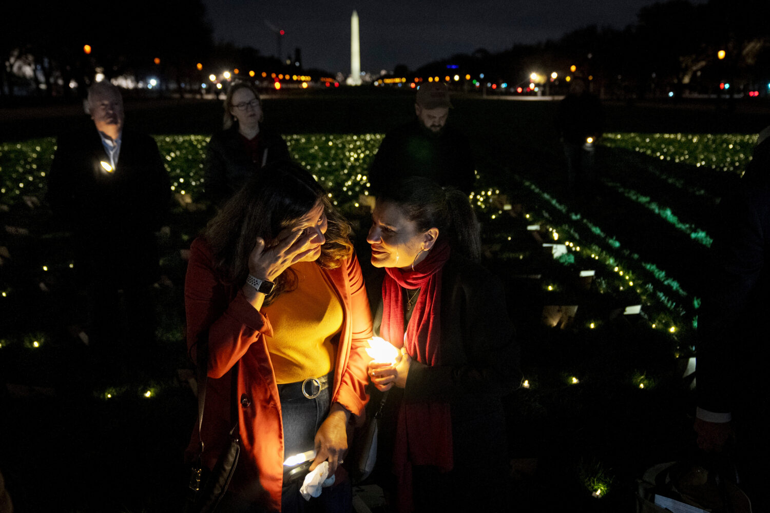 FILE - Madiha Maria, left, cries with Rana Abbas Taylor of Northville, Mich., who lost her only sis...