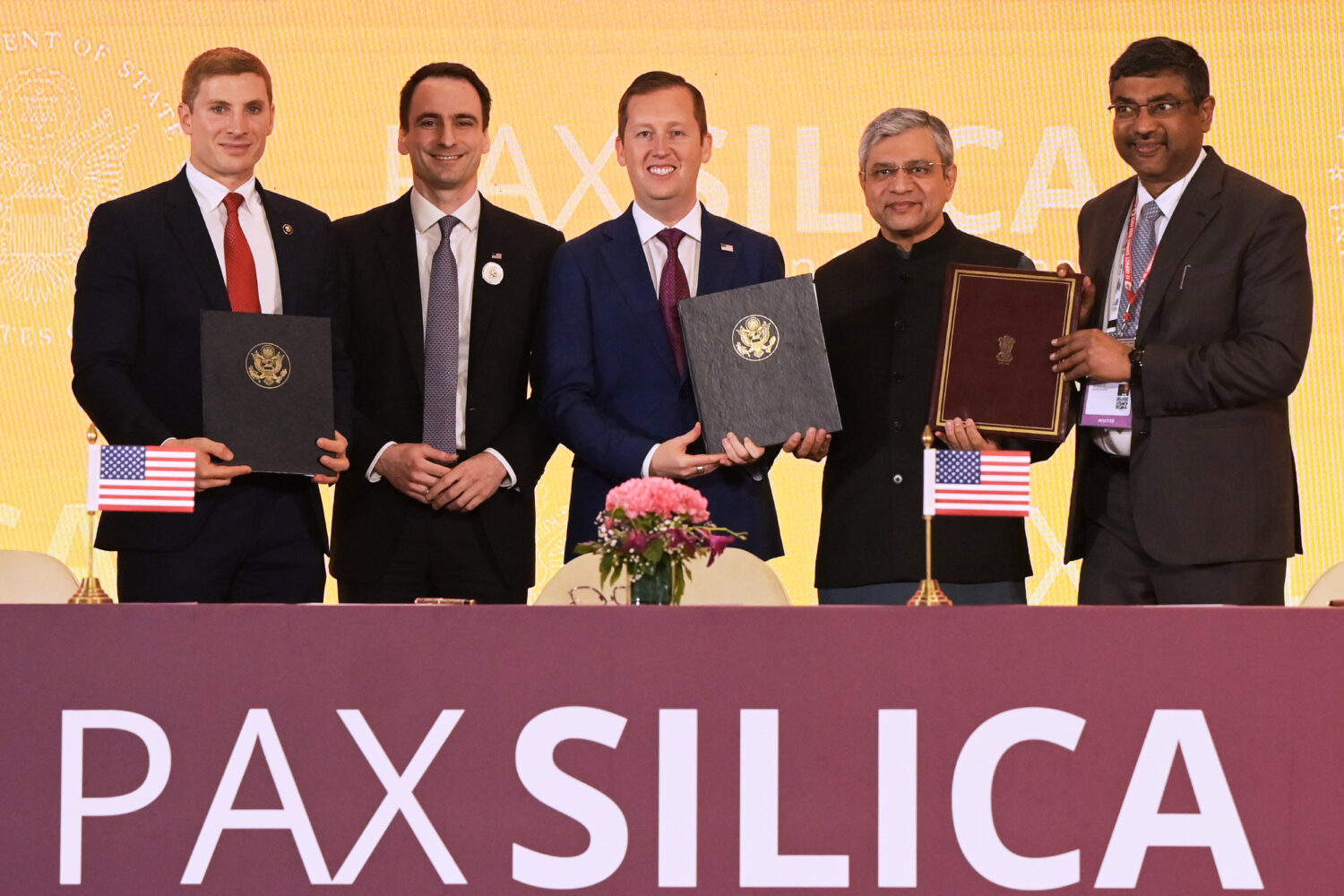 India's IT Minister Ashwini Vaishnaw, second right, poses for a photograph with U.S. Ambassador to ...