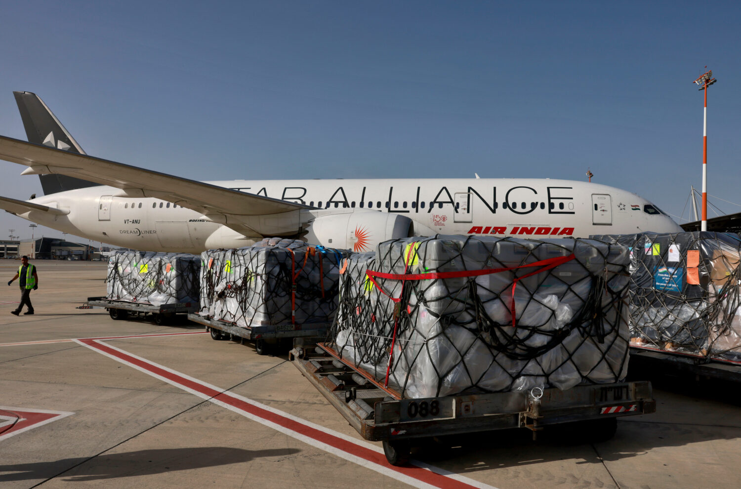 FILE -Workers load medical aid onto an Air India plane to be flown to India, at Ben Gurion Airport ...