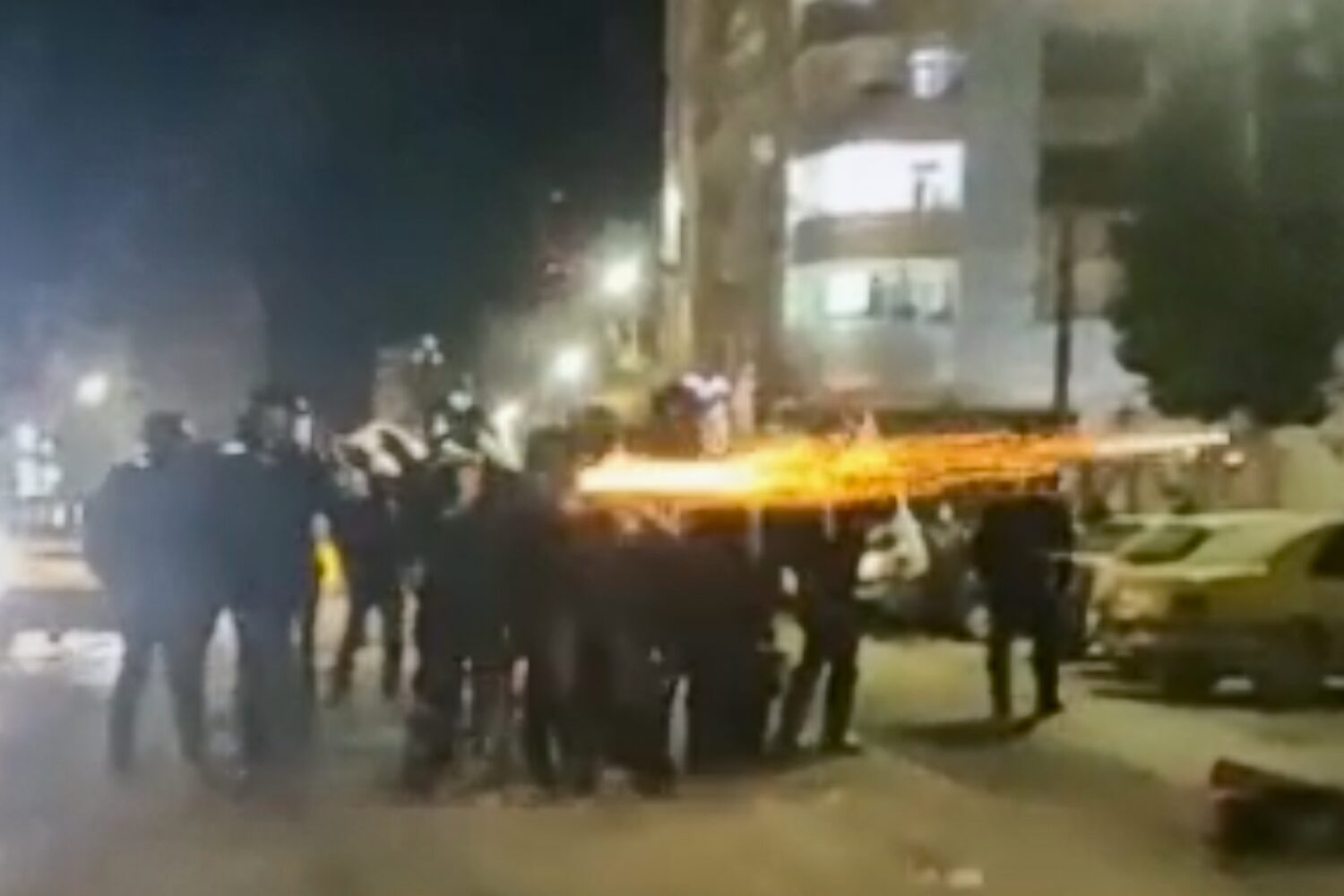FILE - This image from a video verified by AP shows Iranian security forces shooting into the court...