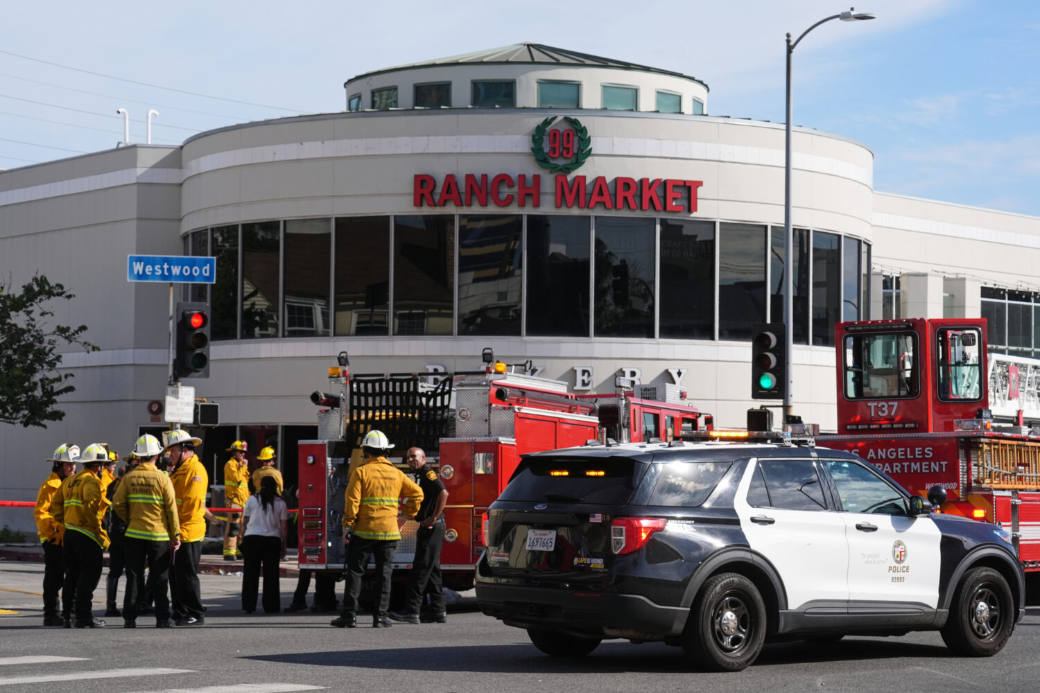 First responders work the scene of a fatal crash outside of a 99 Ranch Market, Thursday, Feb. 5, 20...