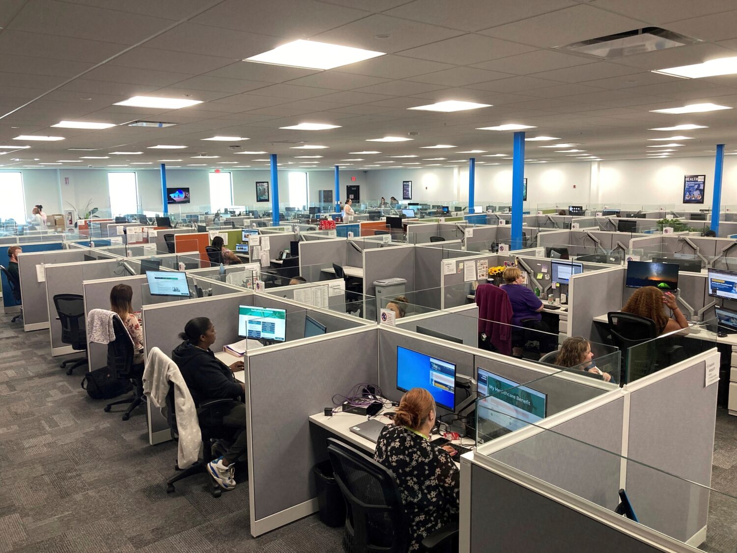 FILE - Workers at a Medicaid call center in Jefferson City, Mo., field questions and review informa...