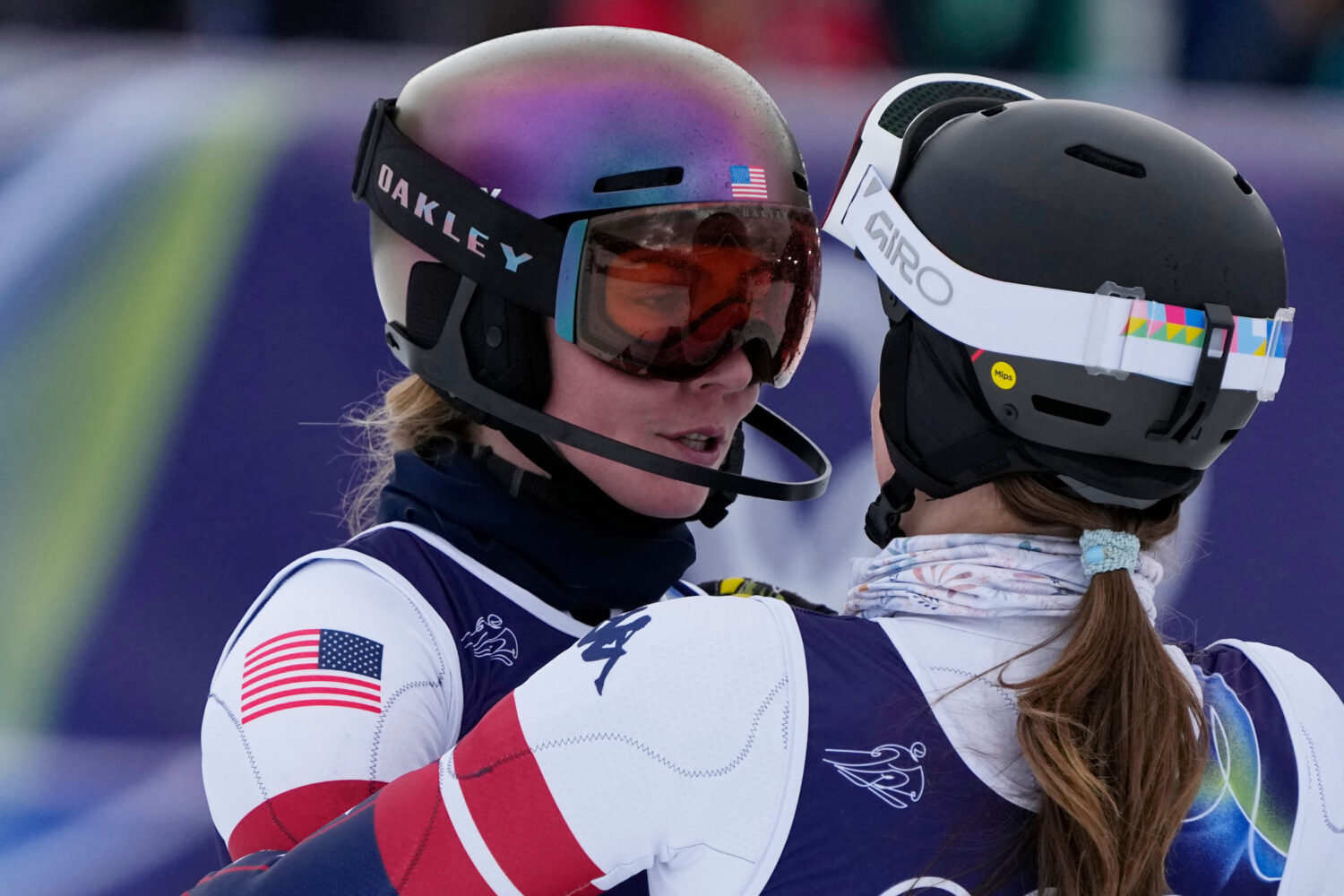 United States' Mikaela Shiffrin, left, is hugged by United States' Paula Moltzan at the finish area...