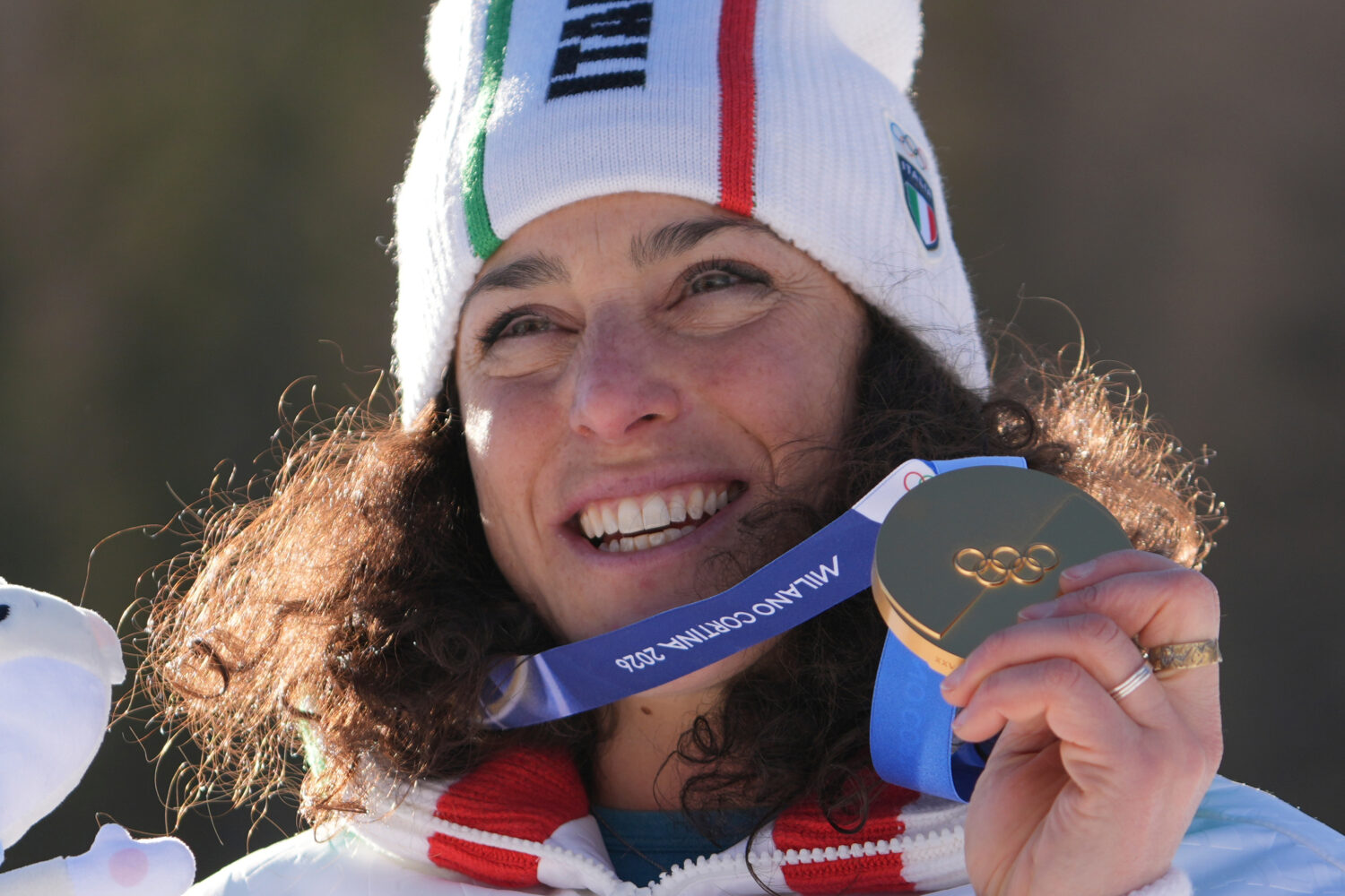 Italy's Federica Brignone shows her gold medal in an alpine ski, women's giant slalom race, at the ...