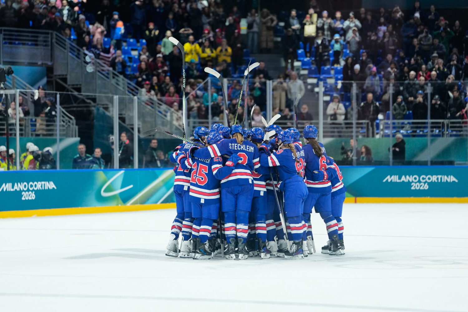 U.S. players celebrate after a semifinal match of women's ice hockey between the United States and ...