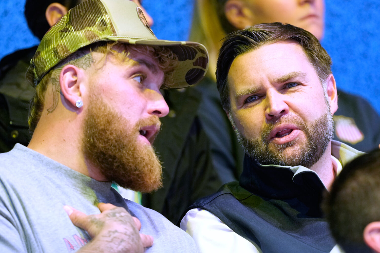 Jake Paul, left, and Vice President JD Vance attend a preliminary round match of women's ice hockey...
