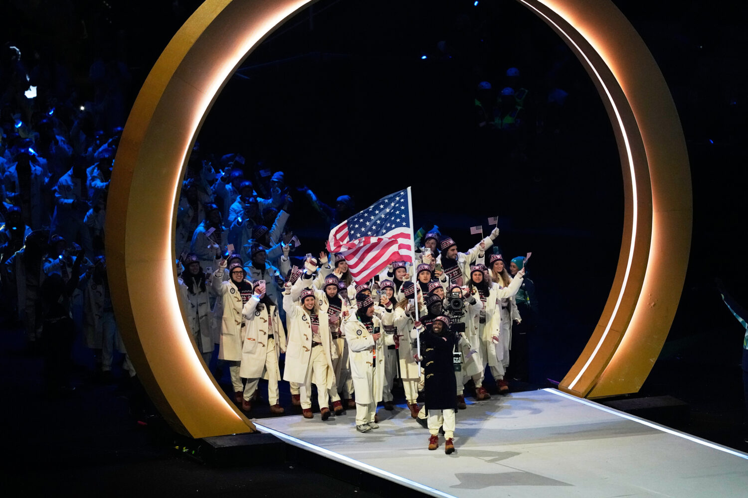 Athletes from United States attend the Olympic opening ceremony at the 2026 Winter Olympics, in Mil...