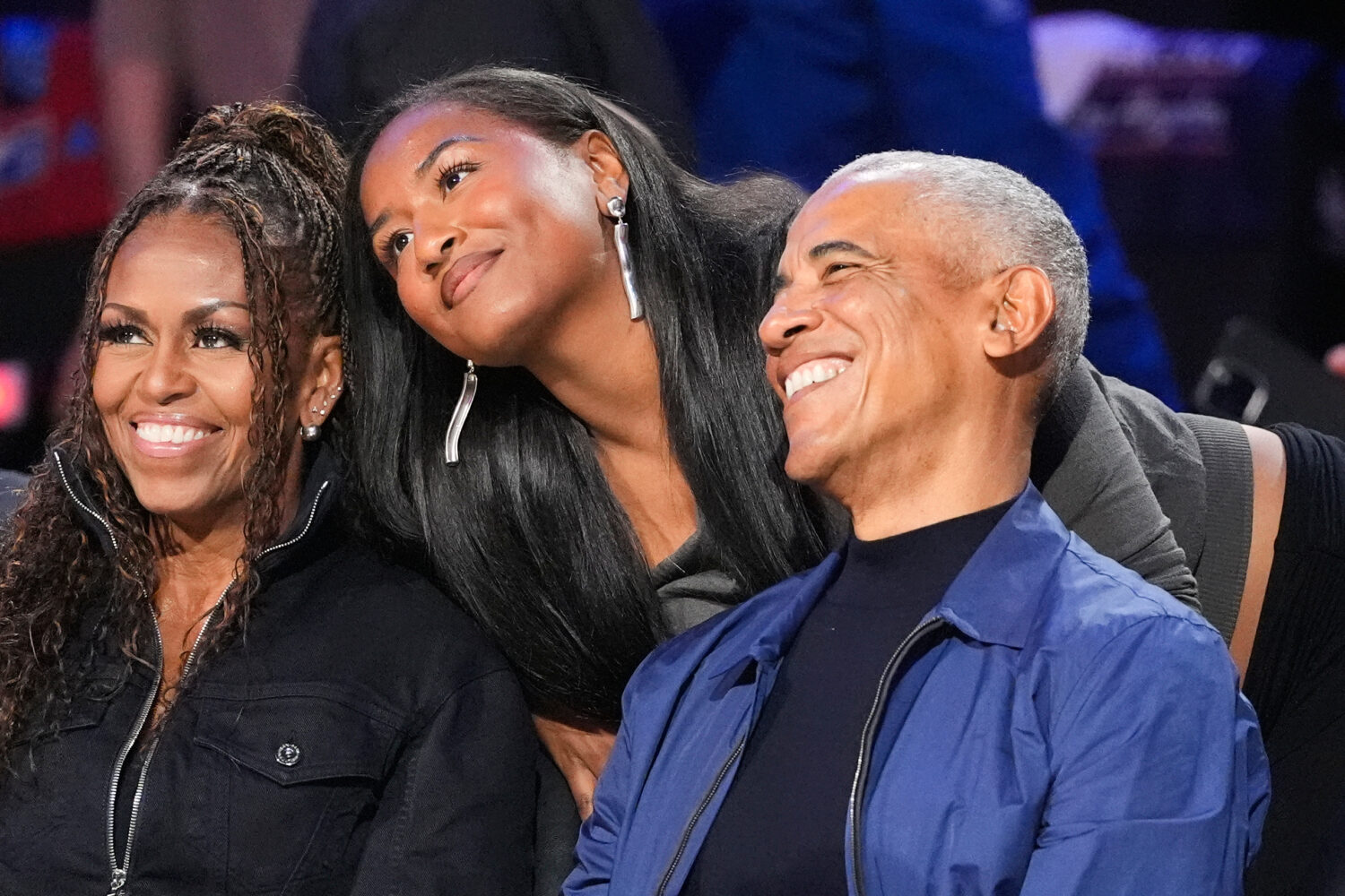 From left, Michelle Obama, Sasha Obama and Barack Obama pose for a photo before the NBA All-Star ba...
