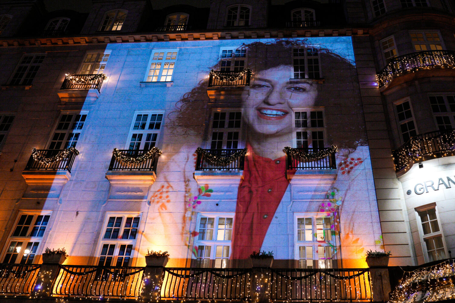 A photo of Nobel Peace Prize recipient Narges Mohammadi is projected on the wall of the Grand Hotel...