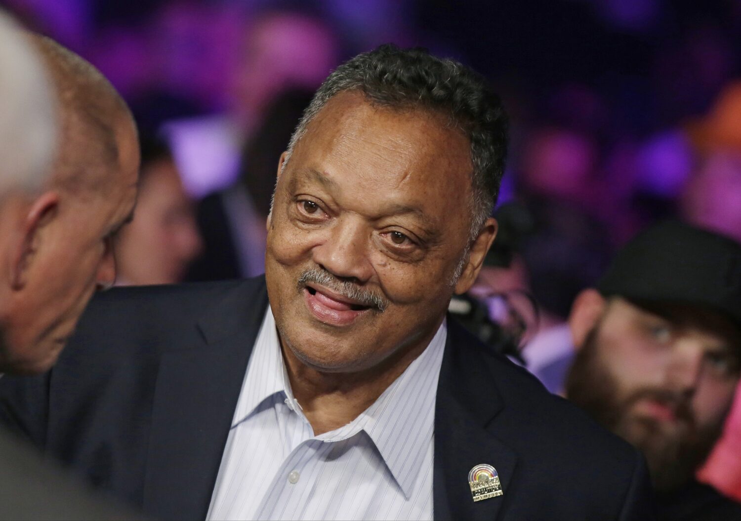 FILE - Jesse Jackson joins the crowd before the start of the world welterweight championship bout b...