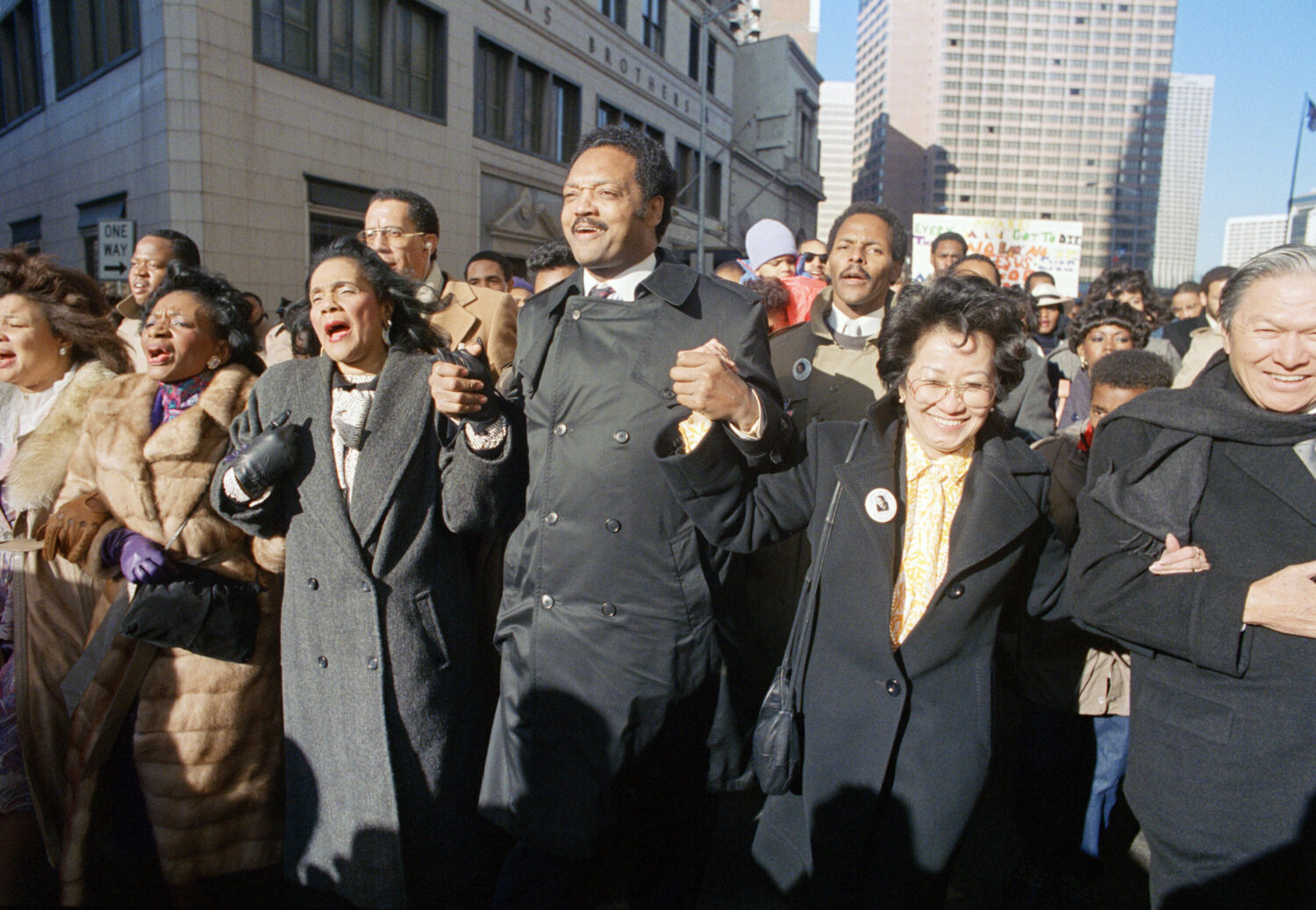 FILE - Coretta Scott King holds hands while singing with the Rev. Jesse Jackson and Christine Farri...