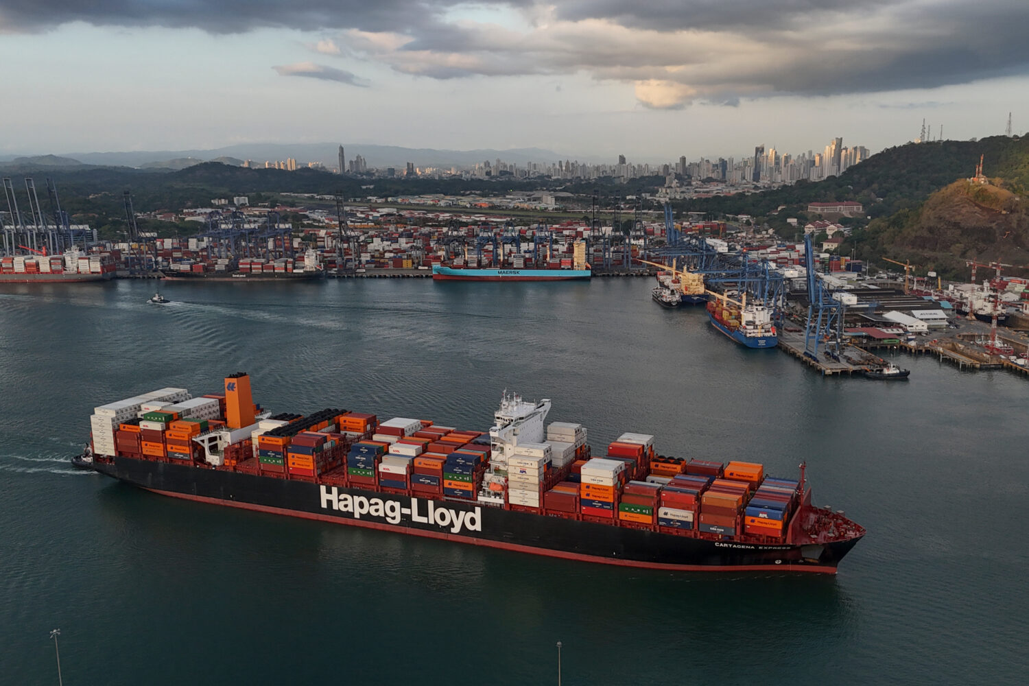 FILE -A cargo ship sails past the Panama Canal's Port of Balboa, managed by CK Hutchison Holdings, ...