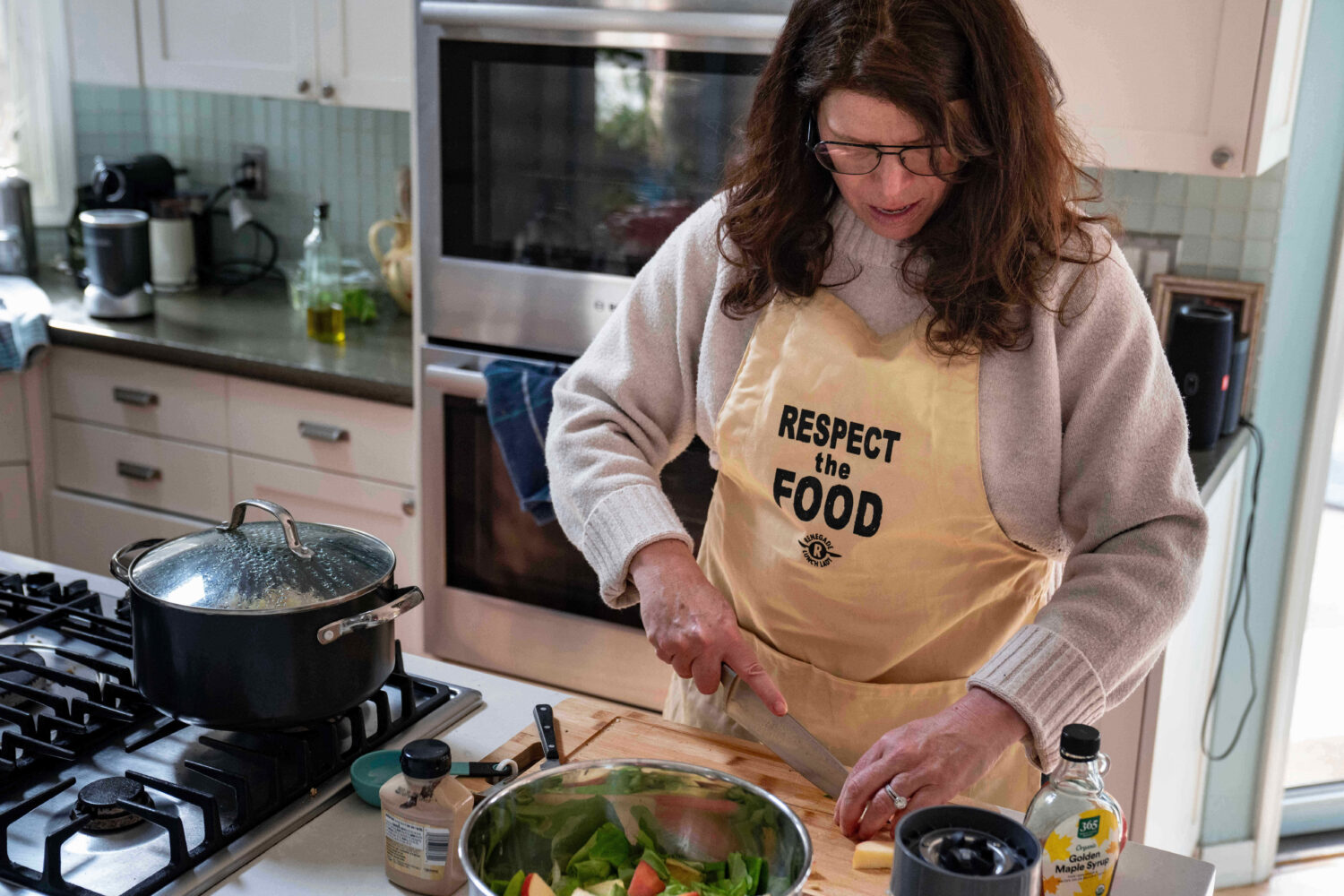 CEO of the Chef Ann Foundation, Mara Fleishman, a winner of this year's Elevate Prize, chops apples...