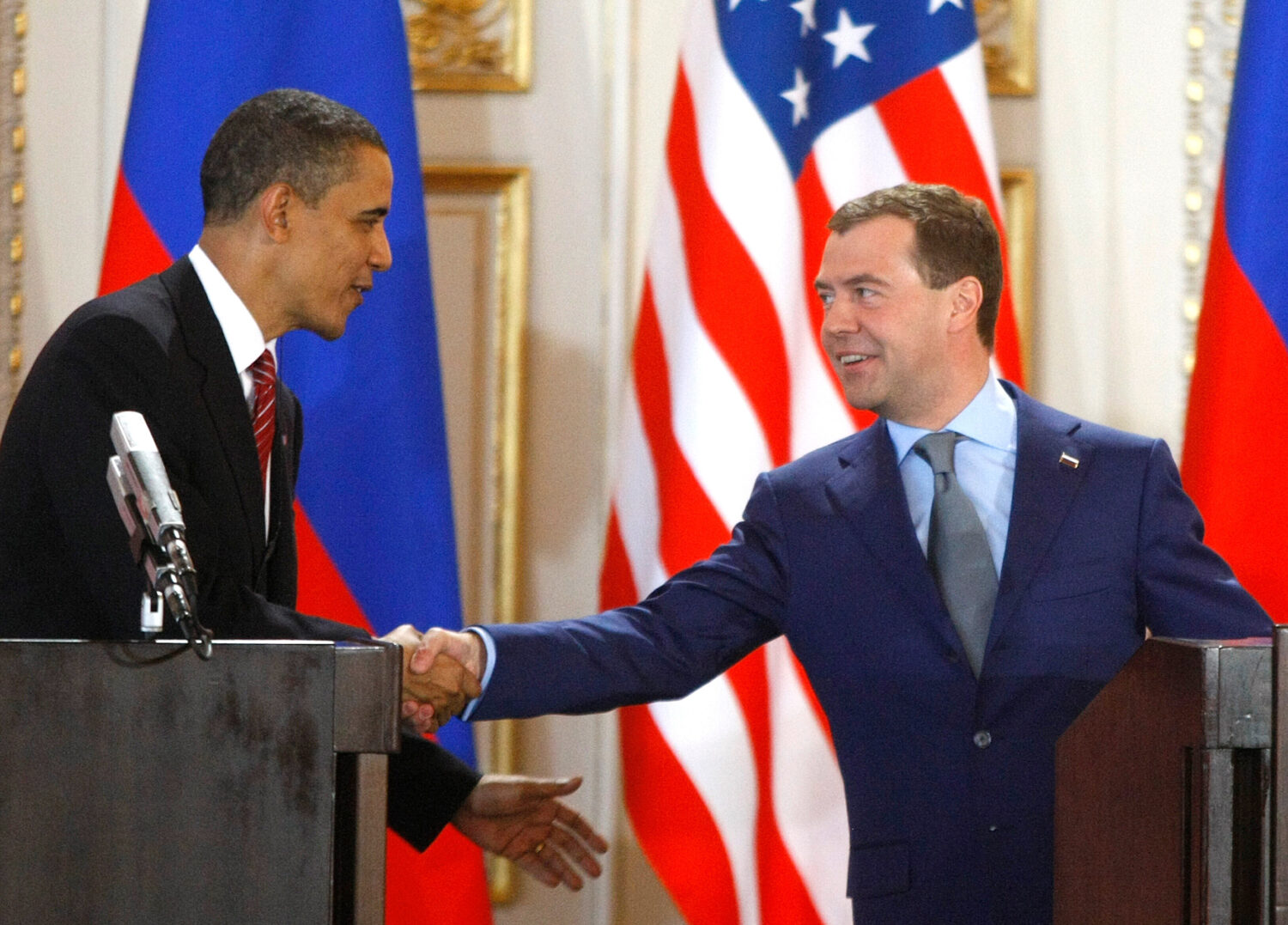 FILE - U.S. President Barack Obama, left, and his Russian counterpart Dmitry Medvedev, right, shake...