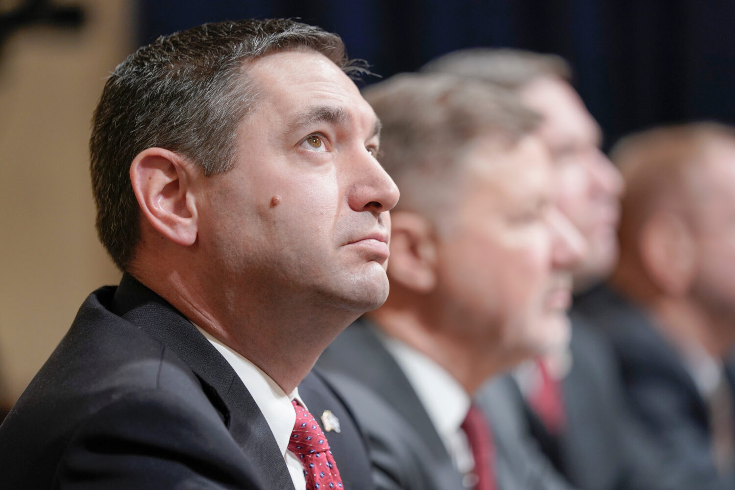 FILE - Montana Attorney General Austin Knudsen, left, testifies during a House Committee on Homelan...