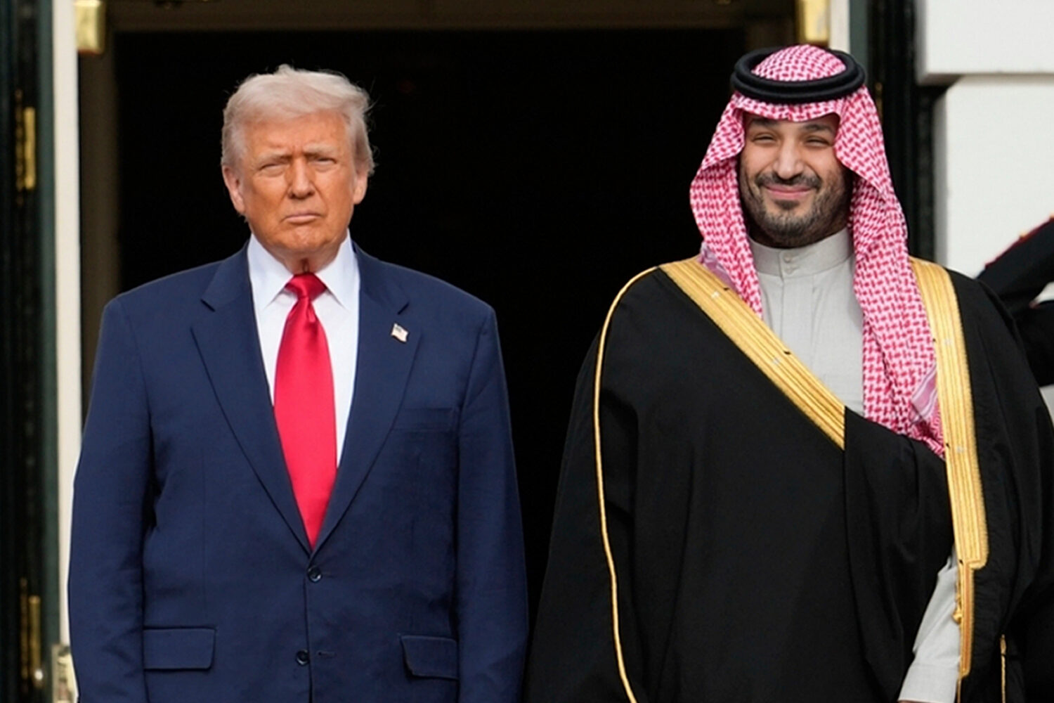 FILE - President Donald Trump stands with Saudi Arabia's Crown Prince Mohammed bin Salman on his vi...