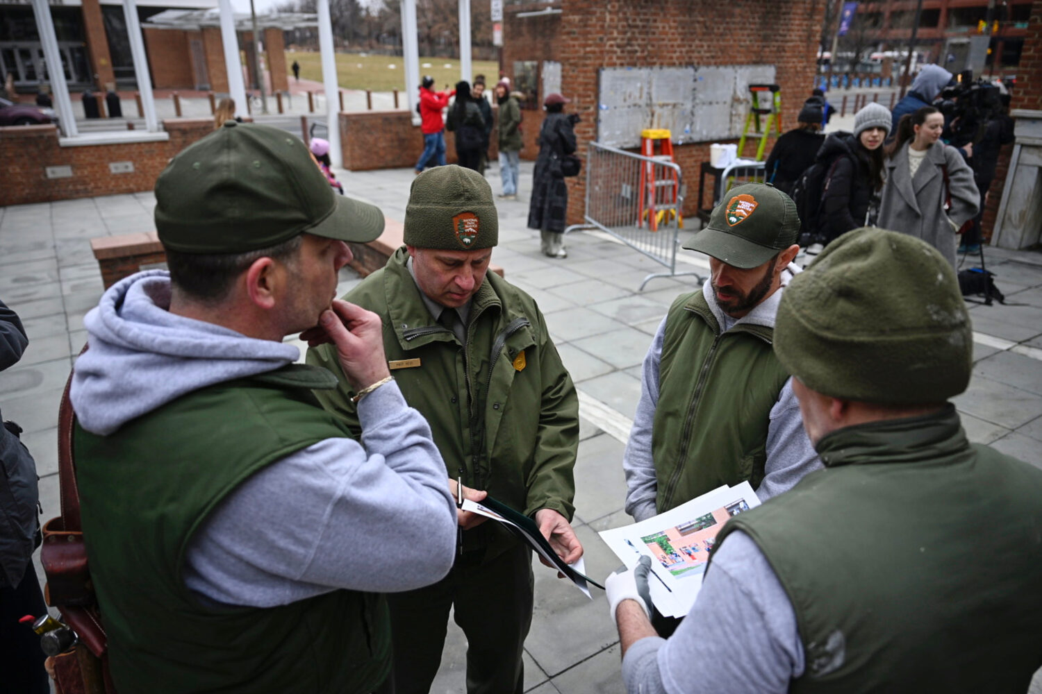 National Parks Service workers gather as panels that were part of an exhibit on slavery at the Pres...