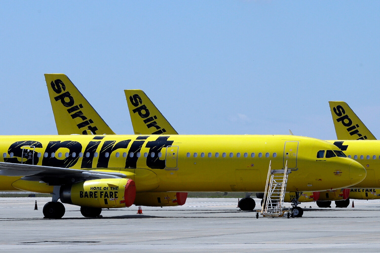 FLE - A line of Spirit Airlines jets sit on the tarmac at the Orlando International Airport on May ...