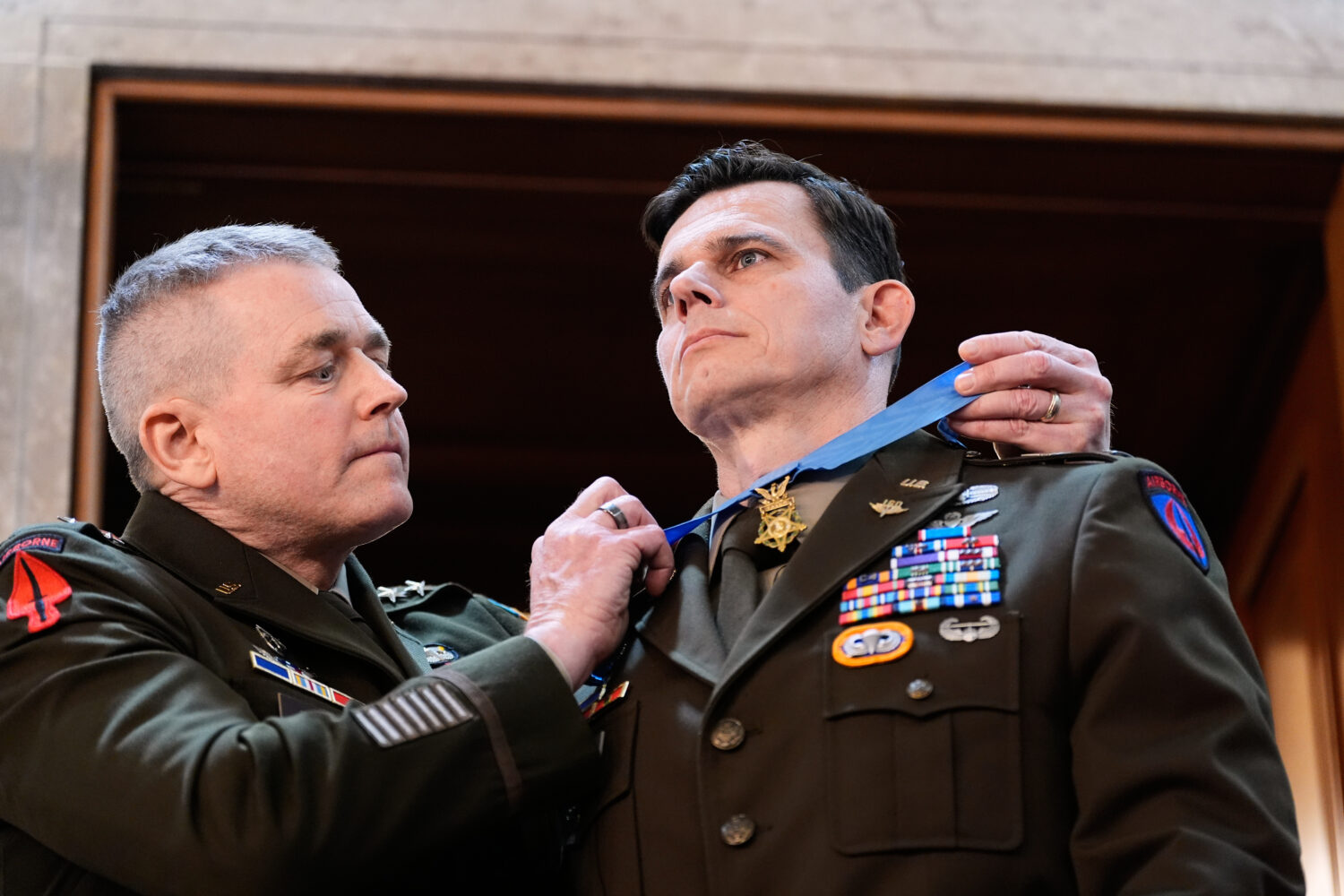 U.S. Army Chief Warrant Officer Eric Slover receives a Medal of Honor during President Donald Trump...