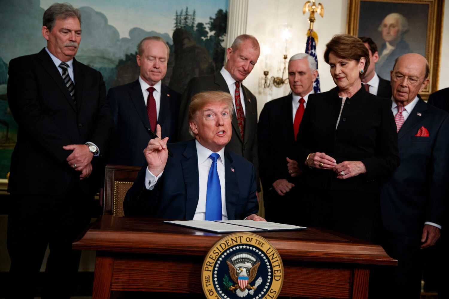 FILE - President Donald Trump speaks before he signs a presidential memorandum imposing tariffs and...