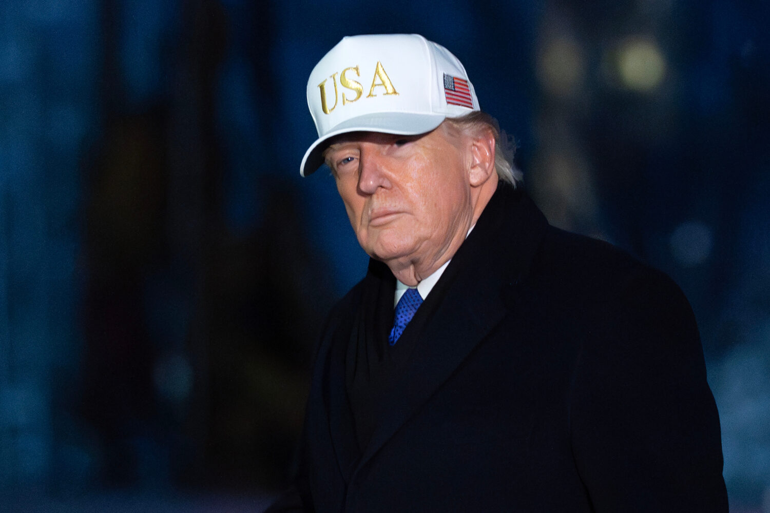 President Donald Trump walks on the South Lawn upon his arrival to the White House, Sunday, Feb. 1,...