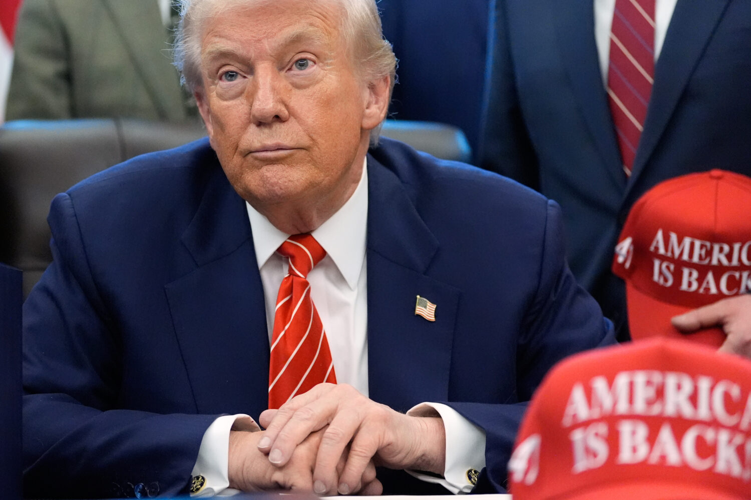President Donald Trump speaks to reporters after signing a spending bill that ends a partial shutdo...
