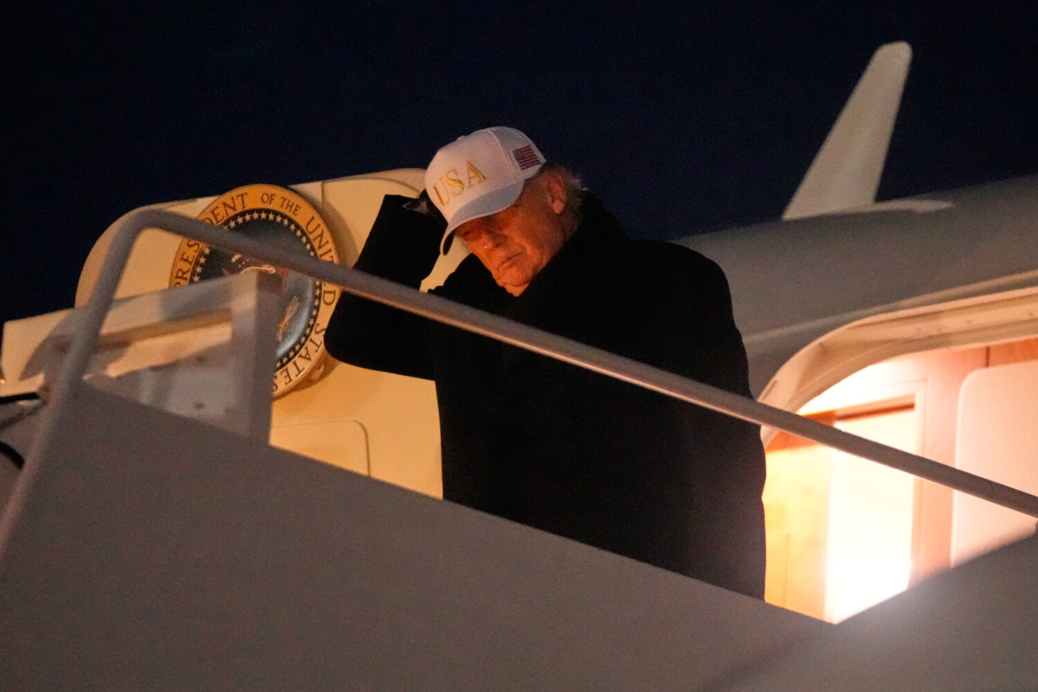 President Donald Trump arrives on Air Force One, Sunday, Feb. 1, 2026, at Joint Base Andrews, Md., ...