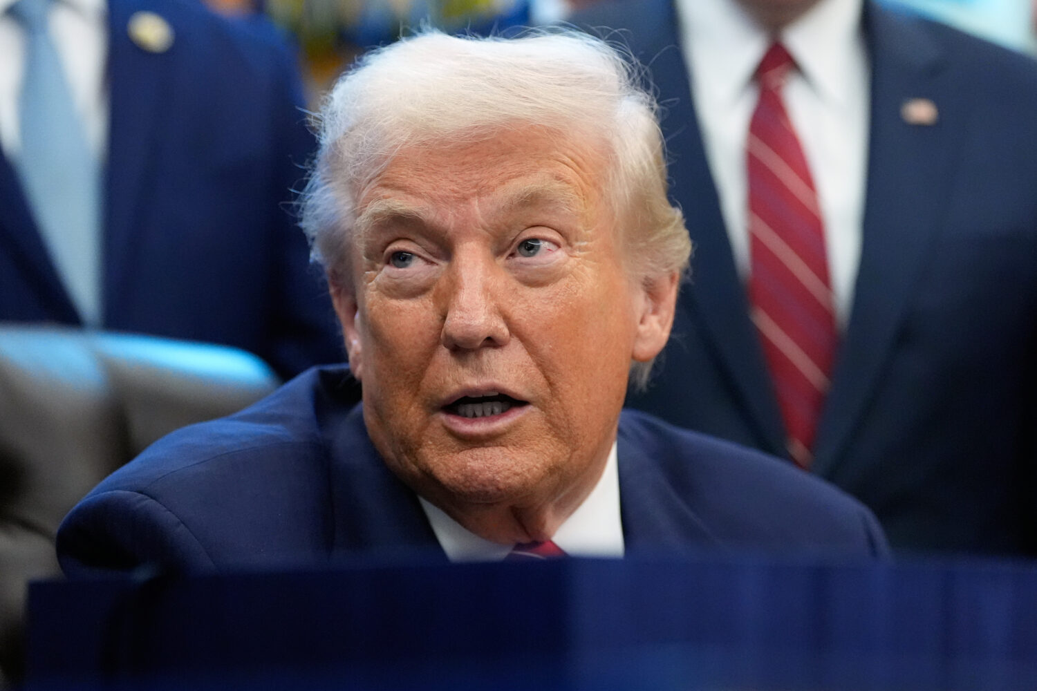 President Donald Trump speaks to reporters after signing a spending bill that ends a partial shutdo...