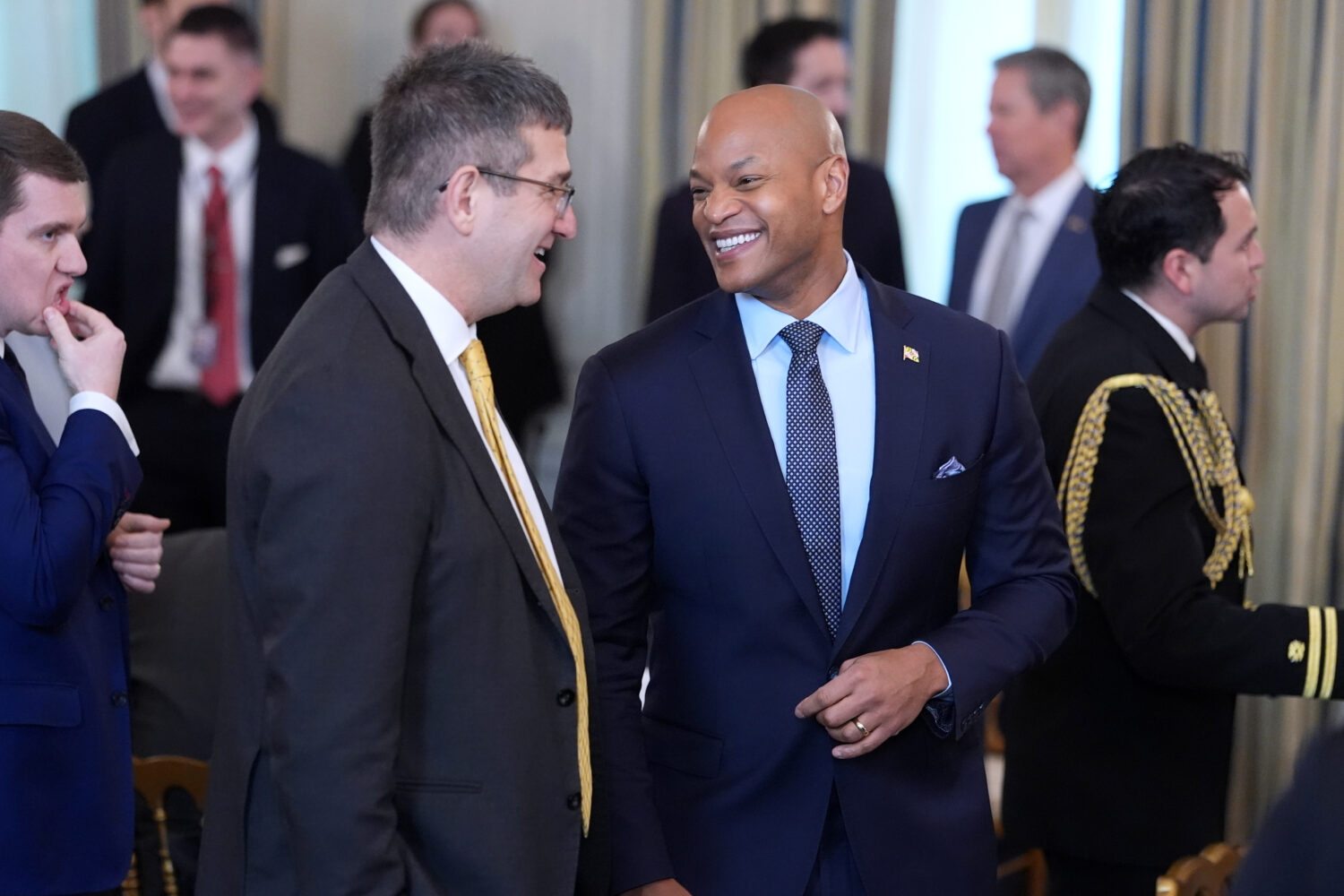 Gov. Wes Moore, D-Md., right, attends a breakfast with the National Governors Association in the St...
