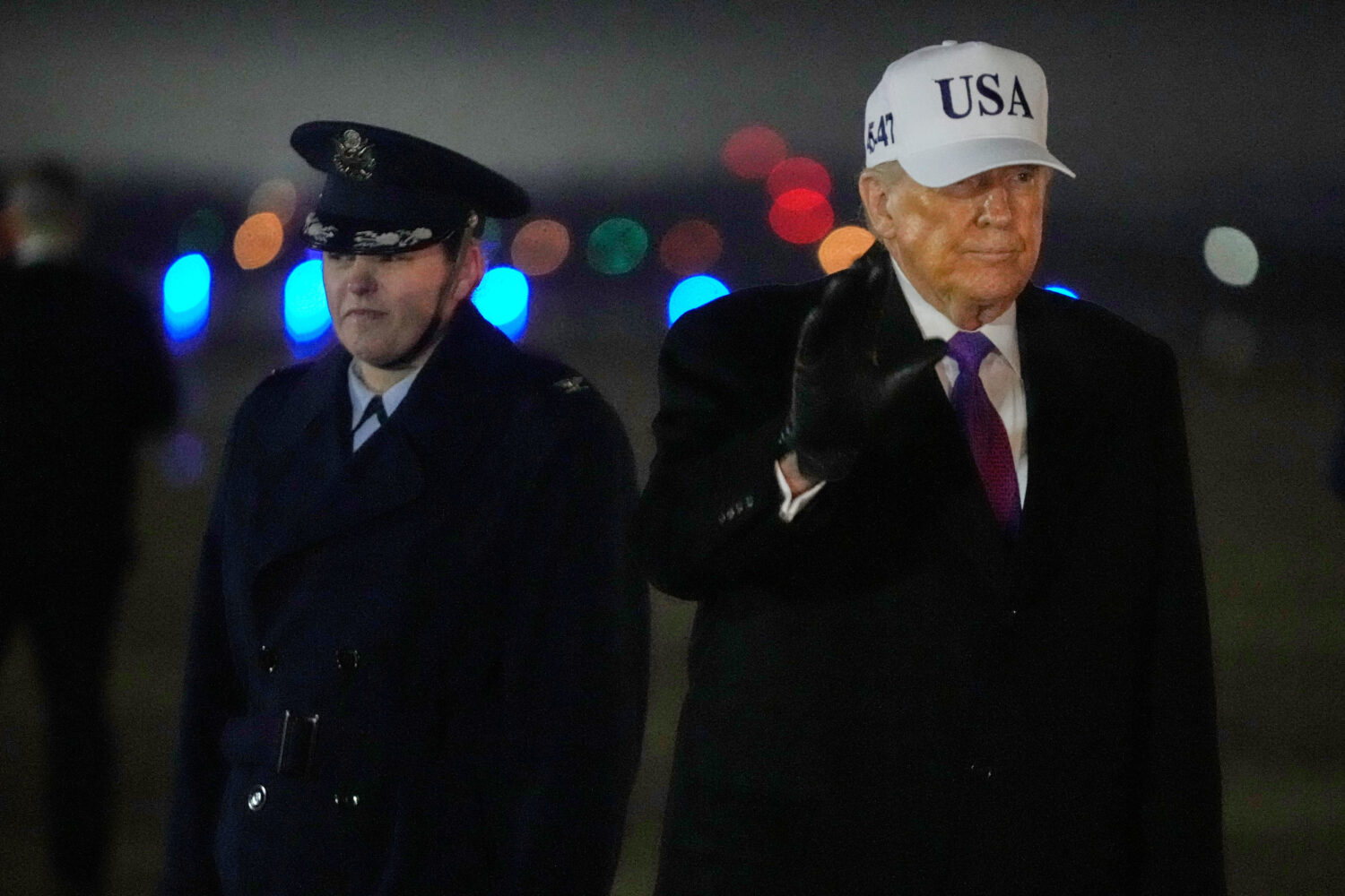 President Donald Trump waves after stepping off Air Force One, Thursday, Feb. 19, 2026, at Joint Ba...