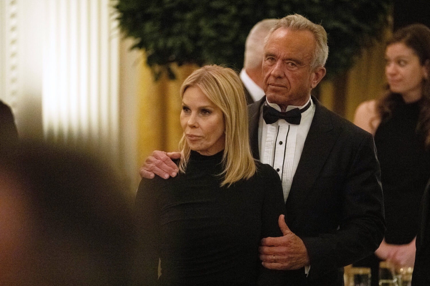Health and Human Services Secretary Robert F. Kennedy Jr. holds his wife, Cheryl Hines, during the ...
