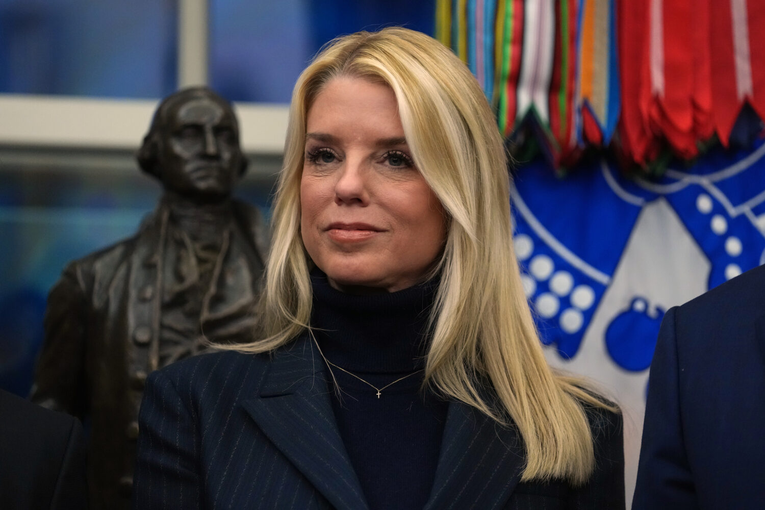 Attorney General Pam Bondi listens as President Donald Trump speaks at an event on addiction recove...