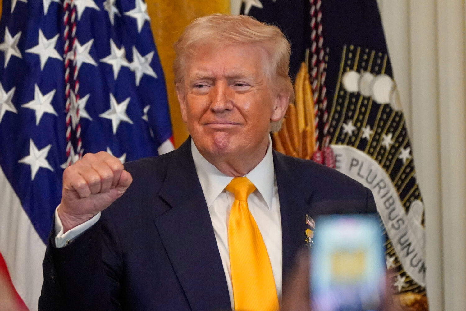 President Donald Trump gestures during a Black History Month event in the East Room of the White Ho...