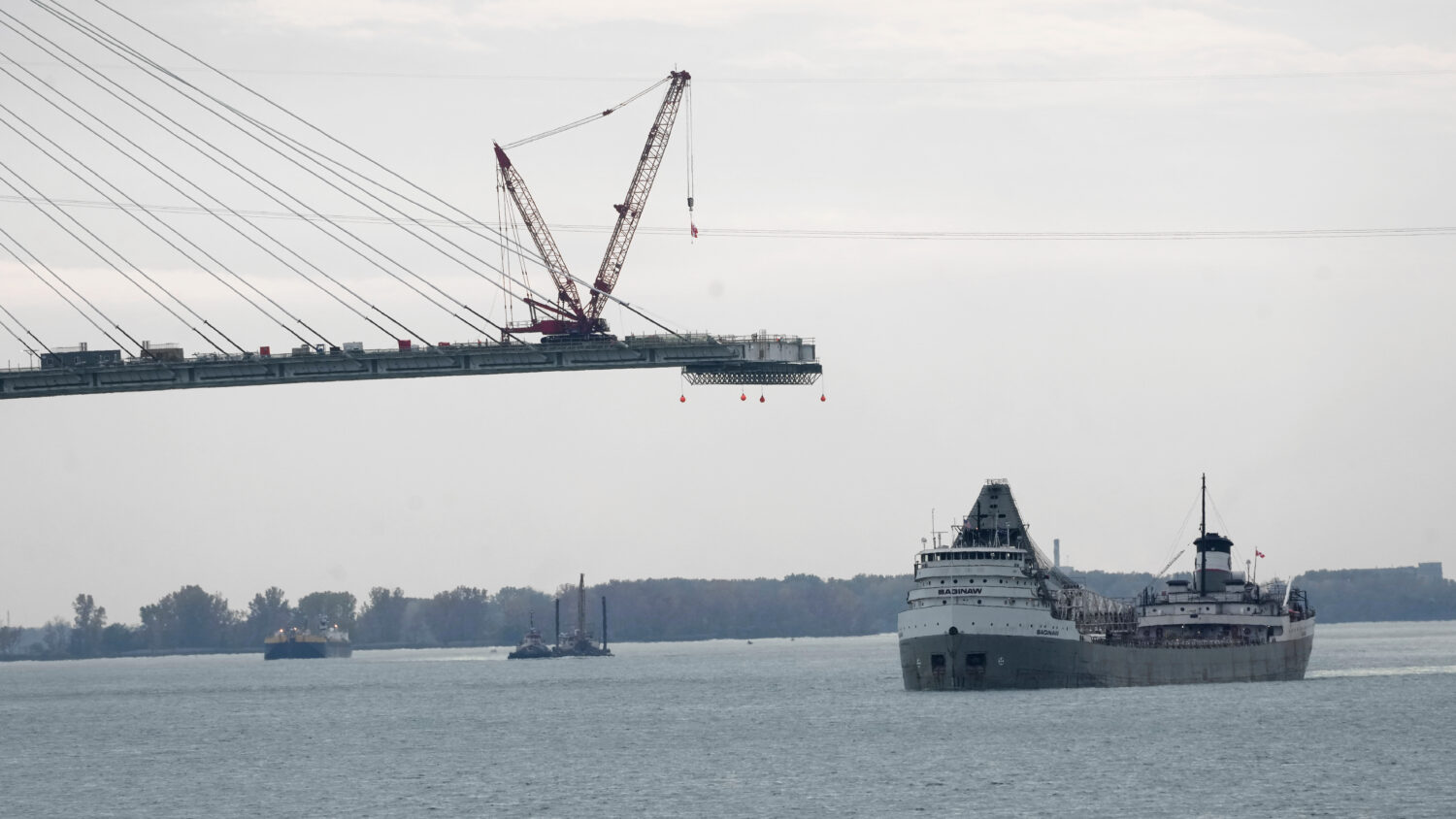 FILE - The Saginaw passes construction on the Gordie Howe International Bridge connecting on the De...