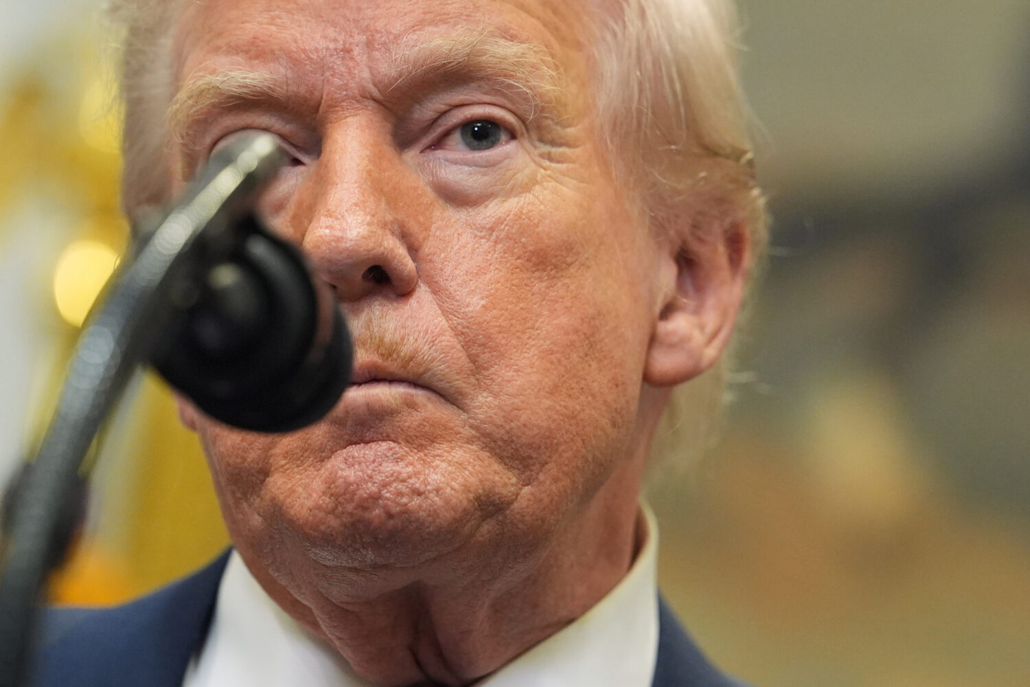 President Donald Trump listens to a question from a reporter during an event with Environmental Pro...