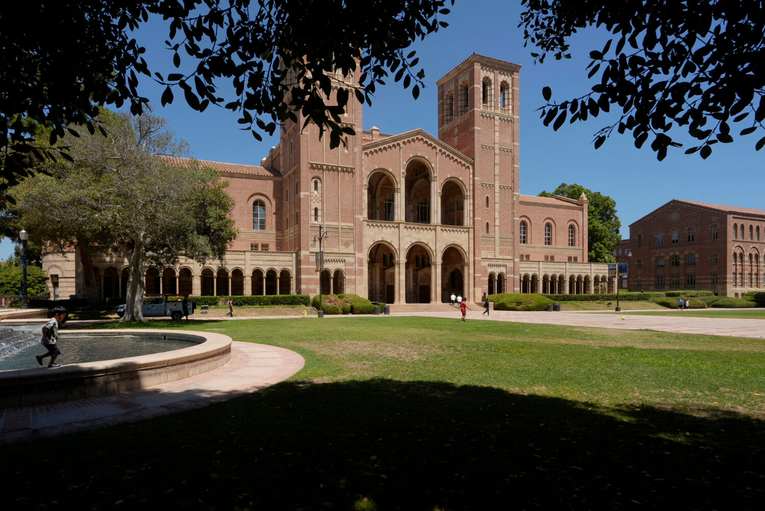 FILE - Children play outside Royce Hall at the University of California, Los Angeles, campus, Aug. ...