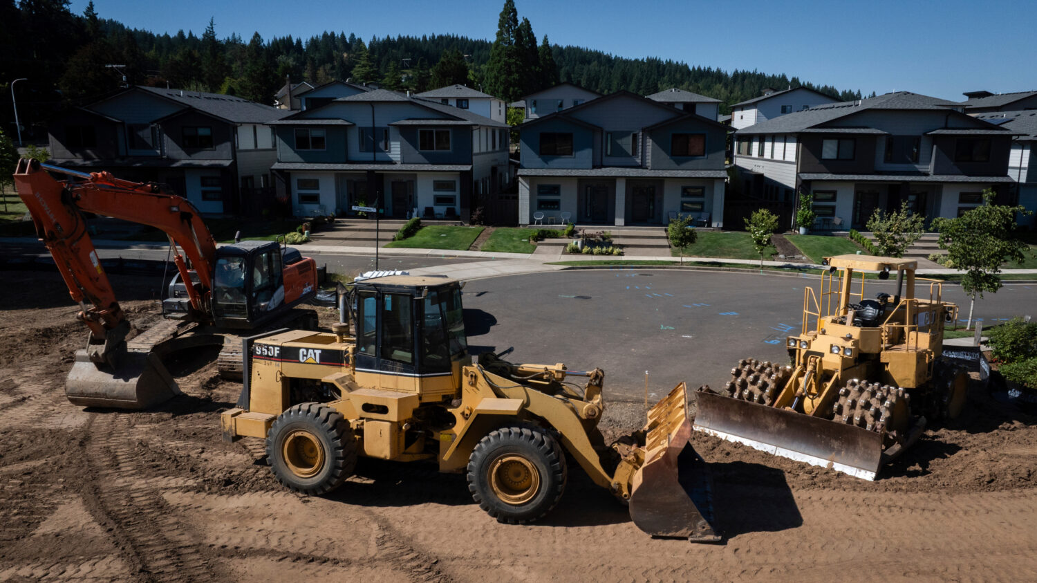 FILE - Construction equipment is seen near new homes on July 11, 2025, in Happy Valley, Ore. (AP Ph...