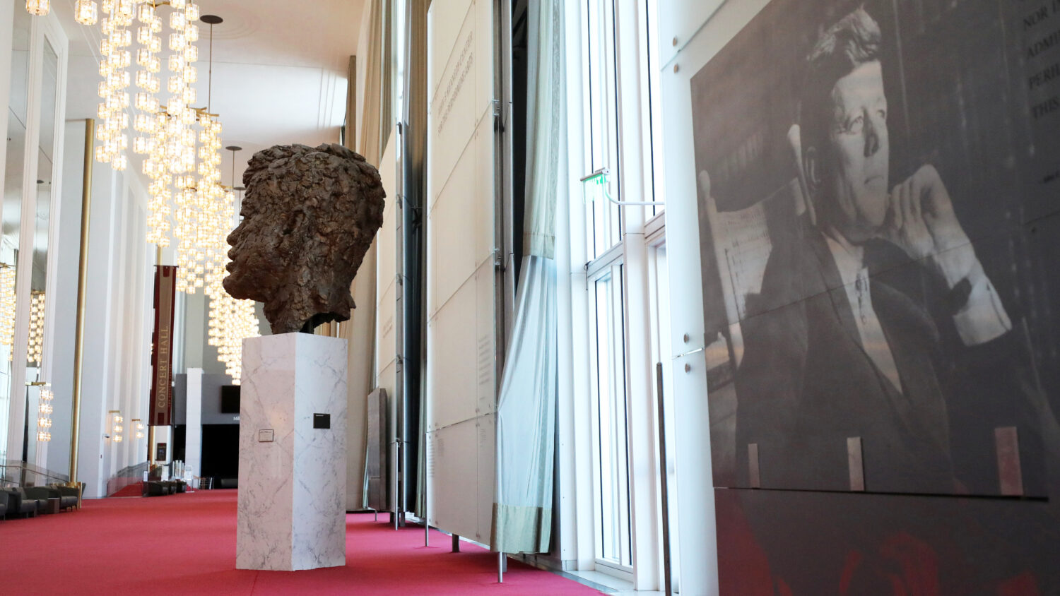 A bronze sculpture of President John F. Kennedy is displayed in the John F. Kennedy Memorial Center...