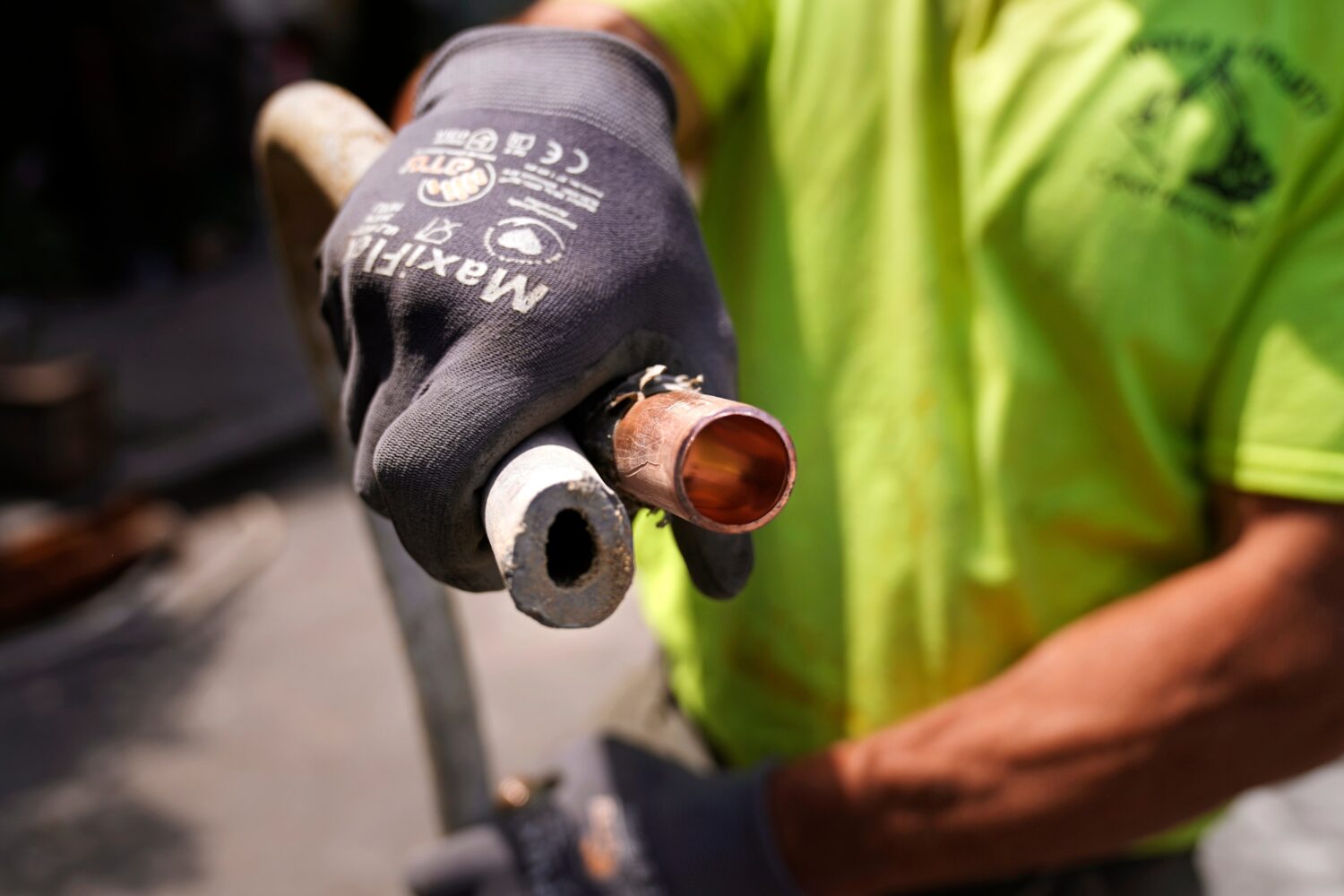 FILE - Richie Nero, of Boyle & Fogarty Construction, shows the the cross section of an original lea...