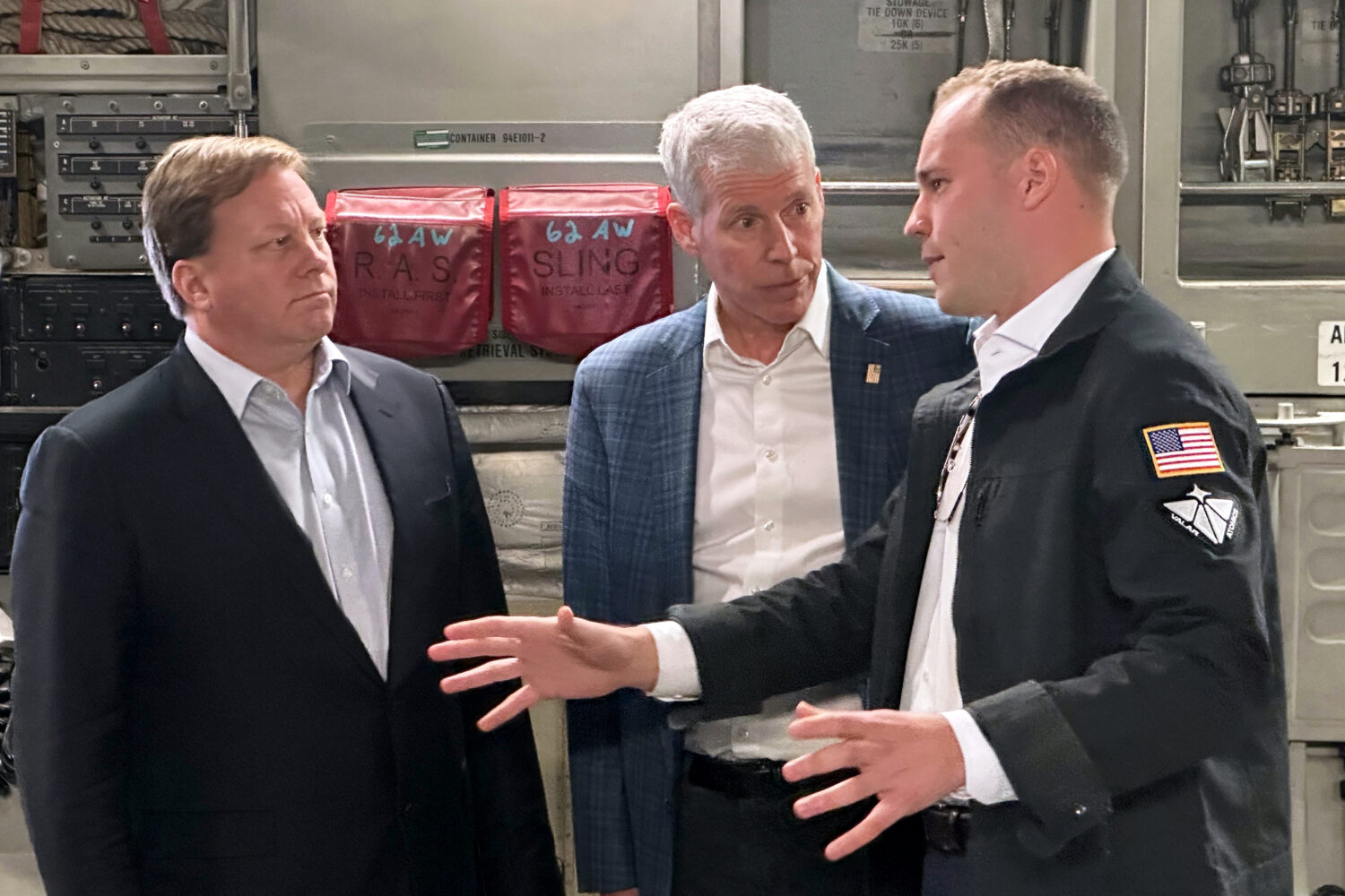 Energy Secretary Chris Wright, center, and Under Secretary of Defense Michael Duffey, left, listen ...