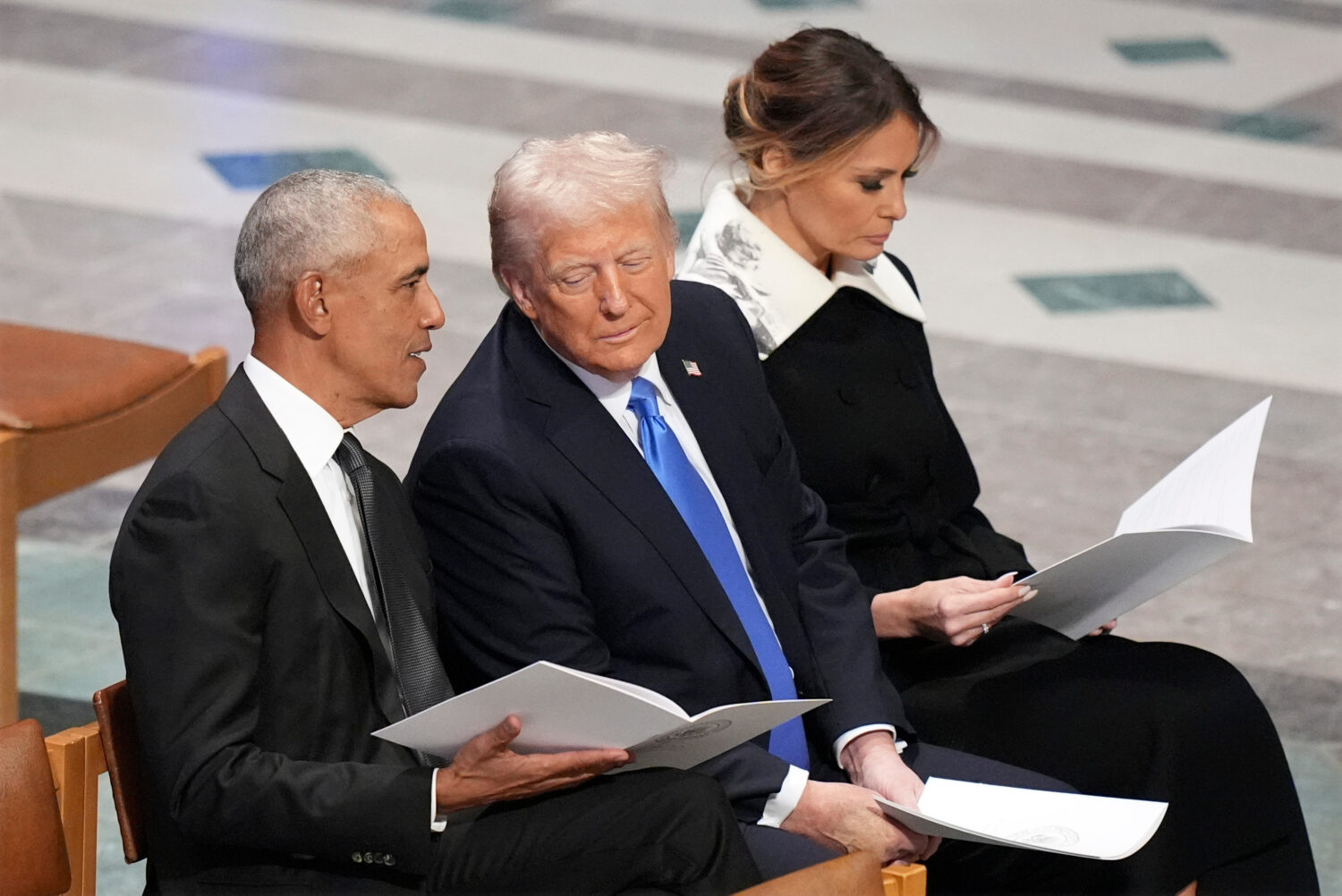 FILE - Former President Barack Obama talks with then President-elect Donald Trump as Melania Trump ...