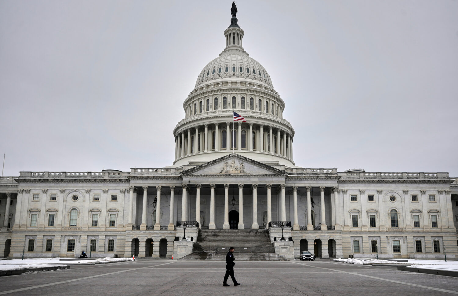 A U.S. Capitol Police officer patrols on the East Front of the U.S. Capitol, Friday, Feb. 6, 2026, ...