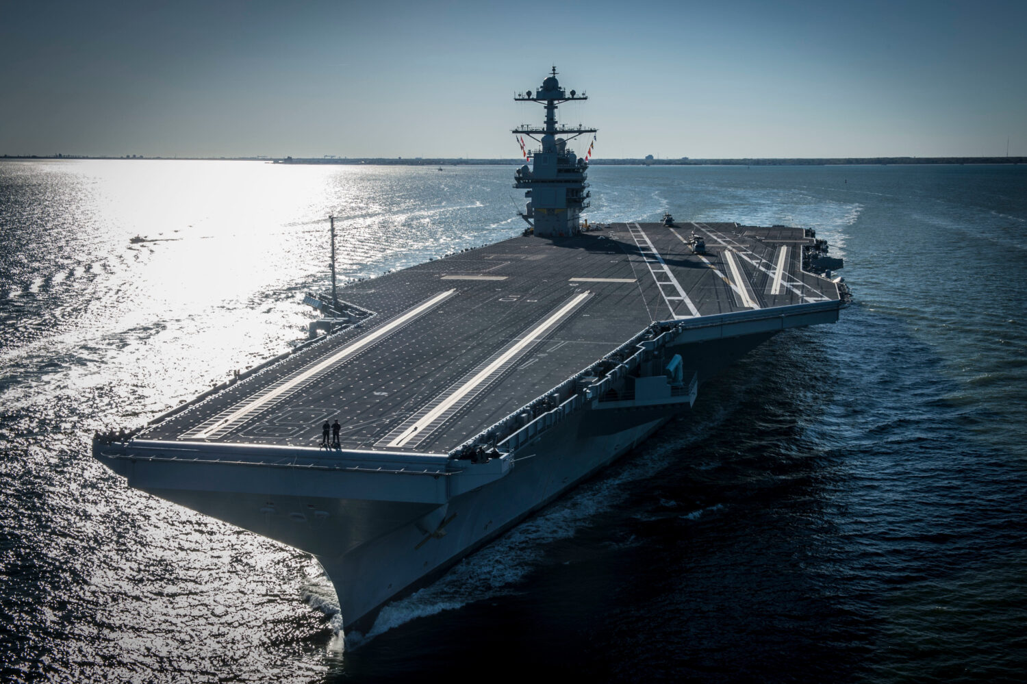 FILE - In this photo provided by the U.S. Navy, the USS Gerald R. Ford embarked on the first of its...