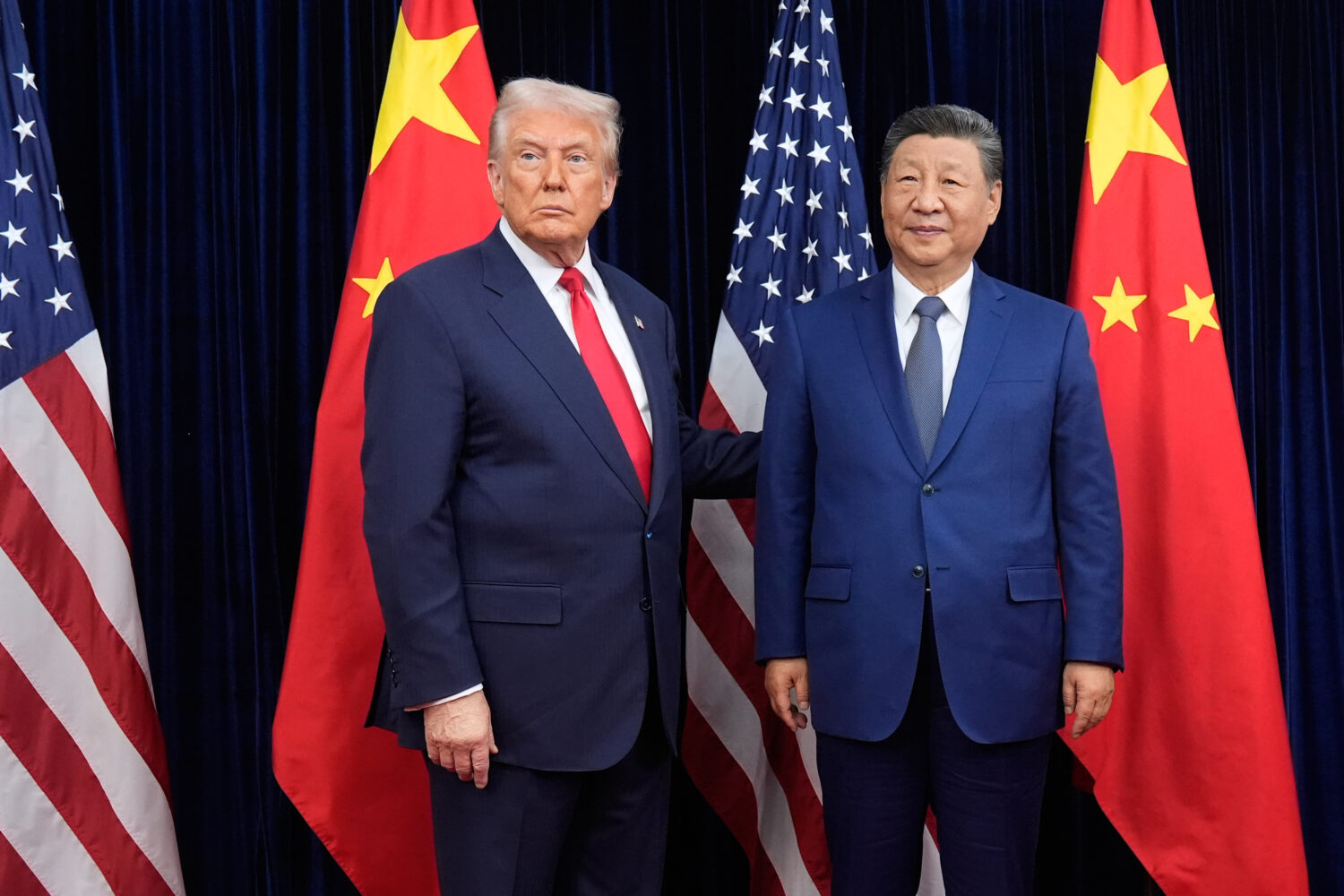 FILE - President Donald Trump, left, and Chinese President Xi Jinping pose ahead of their summit ta...
